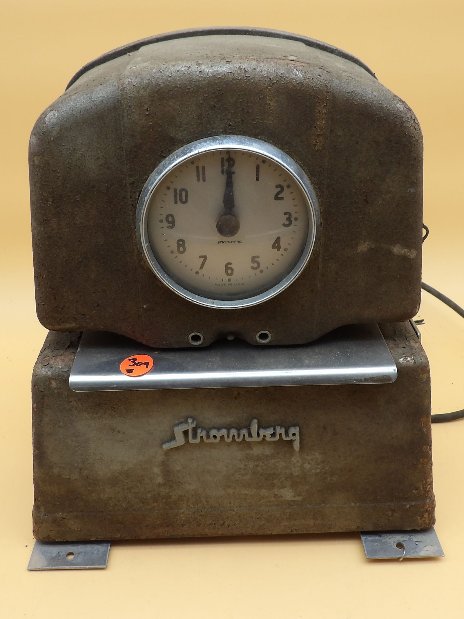 Stromberg Timeclock Machine: This vintage (1930's - 1940's) Stromberg timeclock machine measures 12" x 10" x 6". Has wear, but is sturdy and intact. NO SHIPPING ON THIS ITEM.