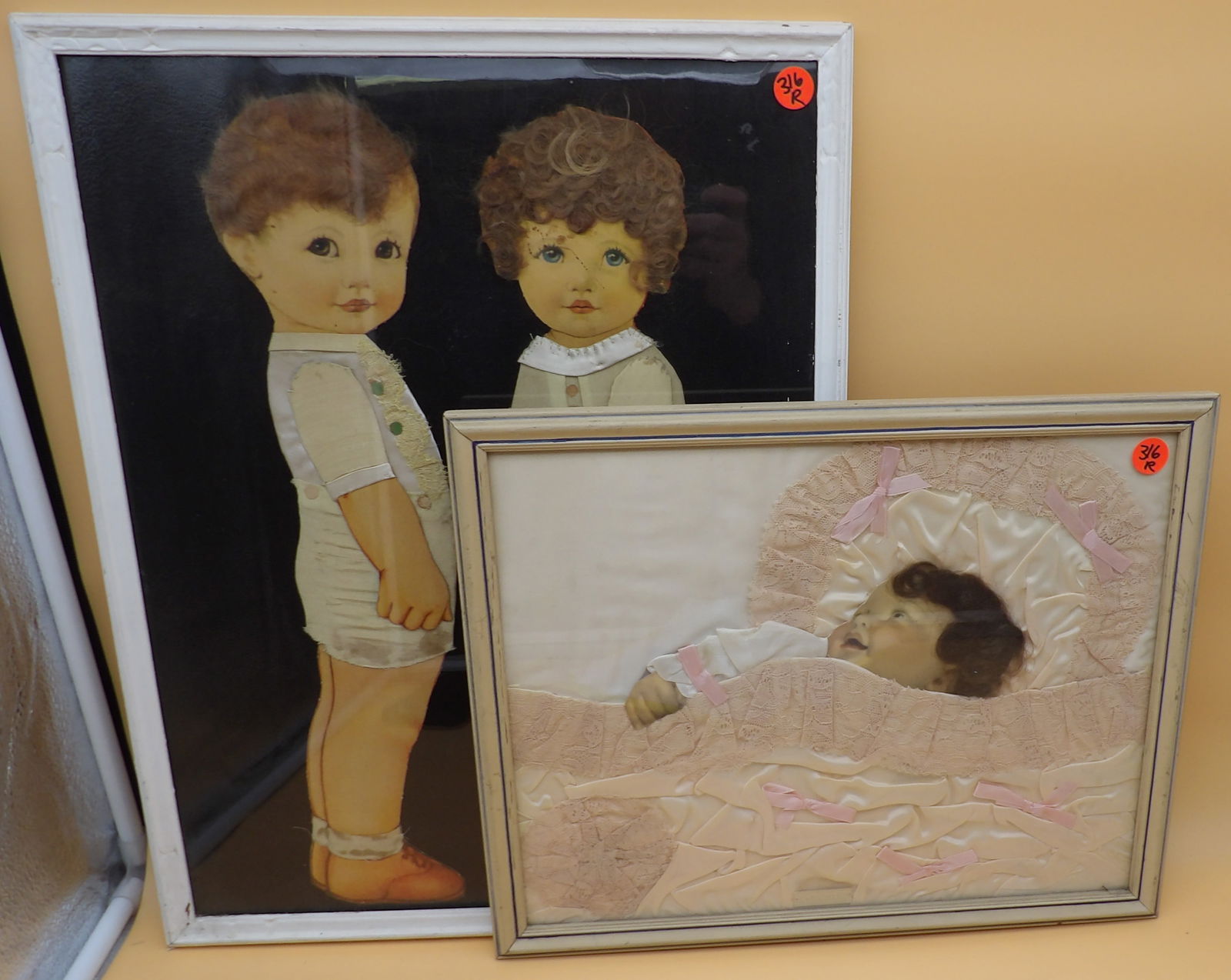 Mourning Baby & Paper Doll Children w/ Real Hair & Cloth: This lot includes a framed Mourning Baby "Chuckles" with real hair and blanket cloth (12" x 15""), and framed paper doll children with real hair and cloth clothing (19" x 15"). Early 20th Century
