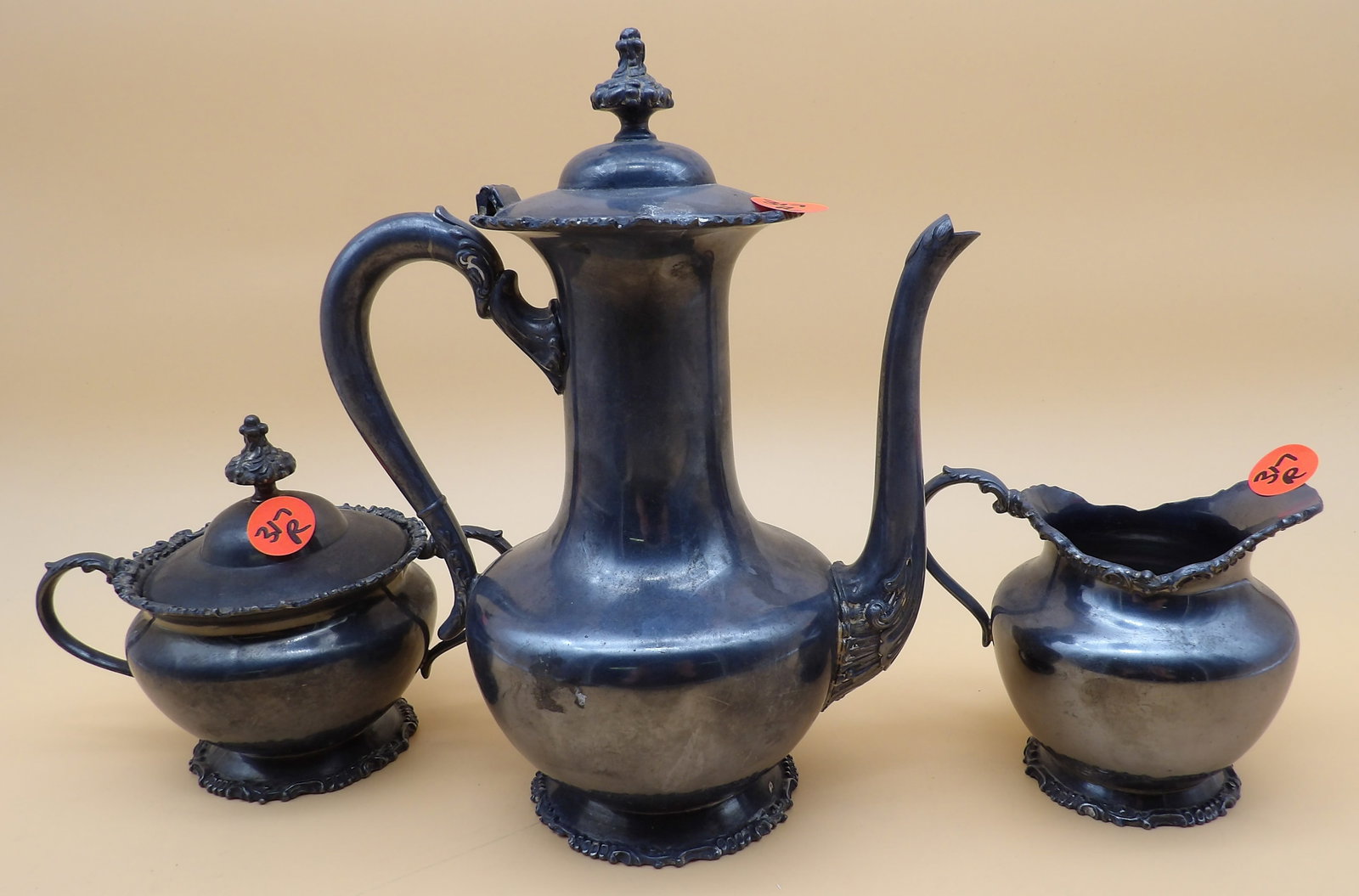 Van Bergh Quadruple Plated / Silver Plated Tea Set (3 pcs): This Van Bergh quadruple plated / silver plated tea set includes a pitcher, lidded sugar bowl, and creamer. Measures 9" x 7"