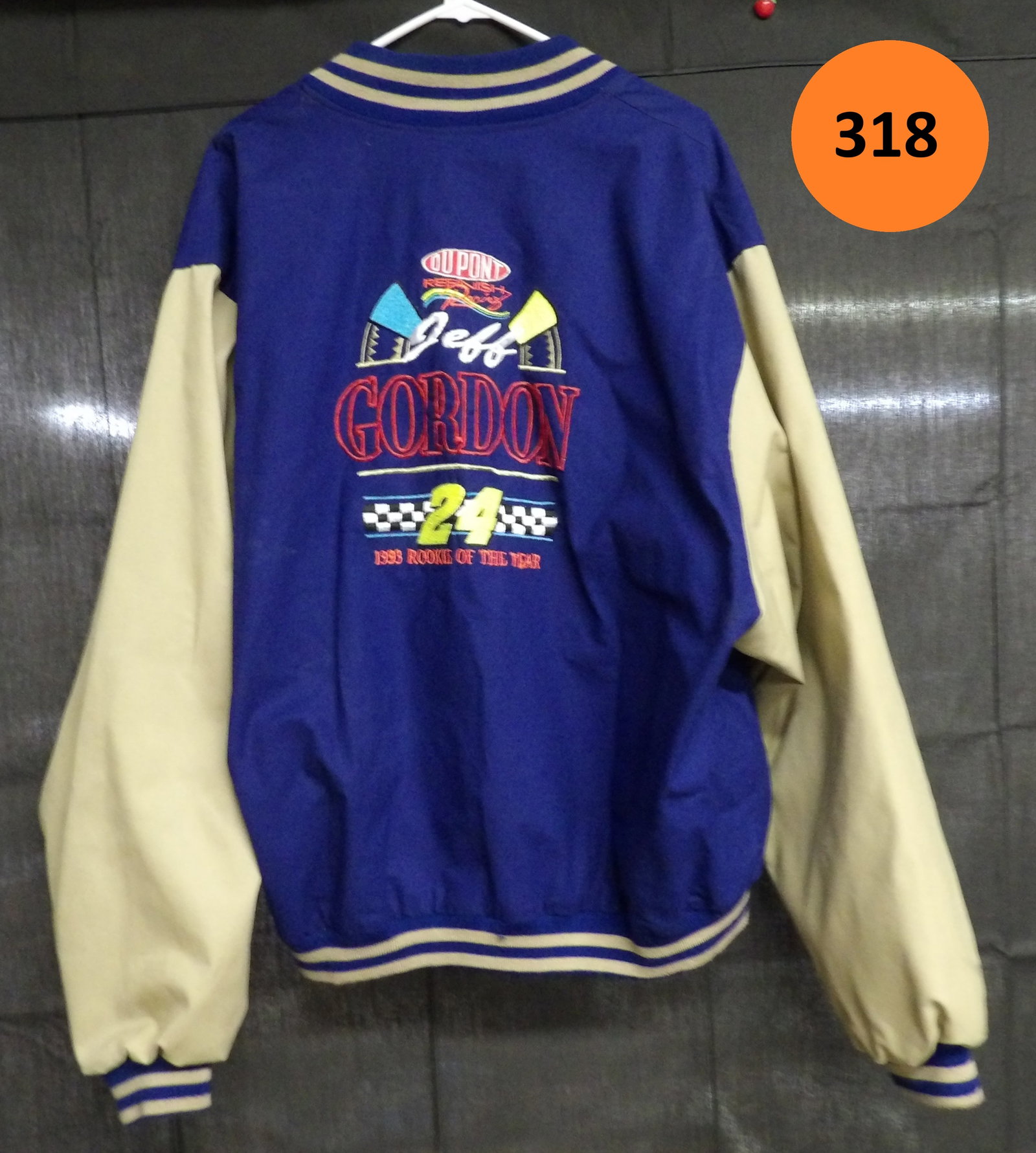 Dupont Jeff Gordon Race Jacket: This Dupont "Refinish Racing" Jeff Gordon jacket is made by Motorsport Traditions and is size XXL.