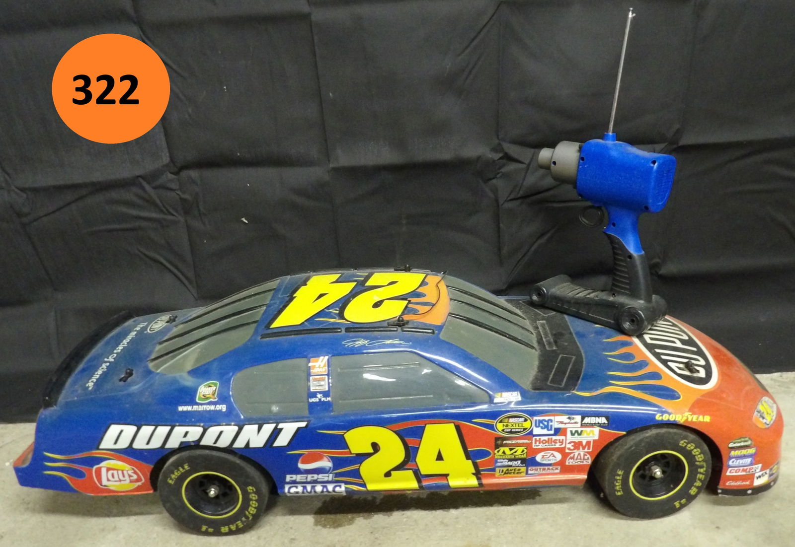 Radio Controlled NASCAR Jeff Gordon Car: This radio-controlled car is a #24 Jeff Gordon / Dupont. Includes remote controller. Measures 33" x 12" x 9". Not tested. NO SHIPPING ON THIS ITEM.