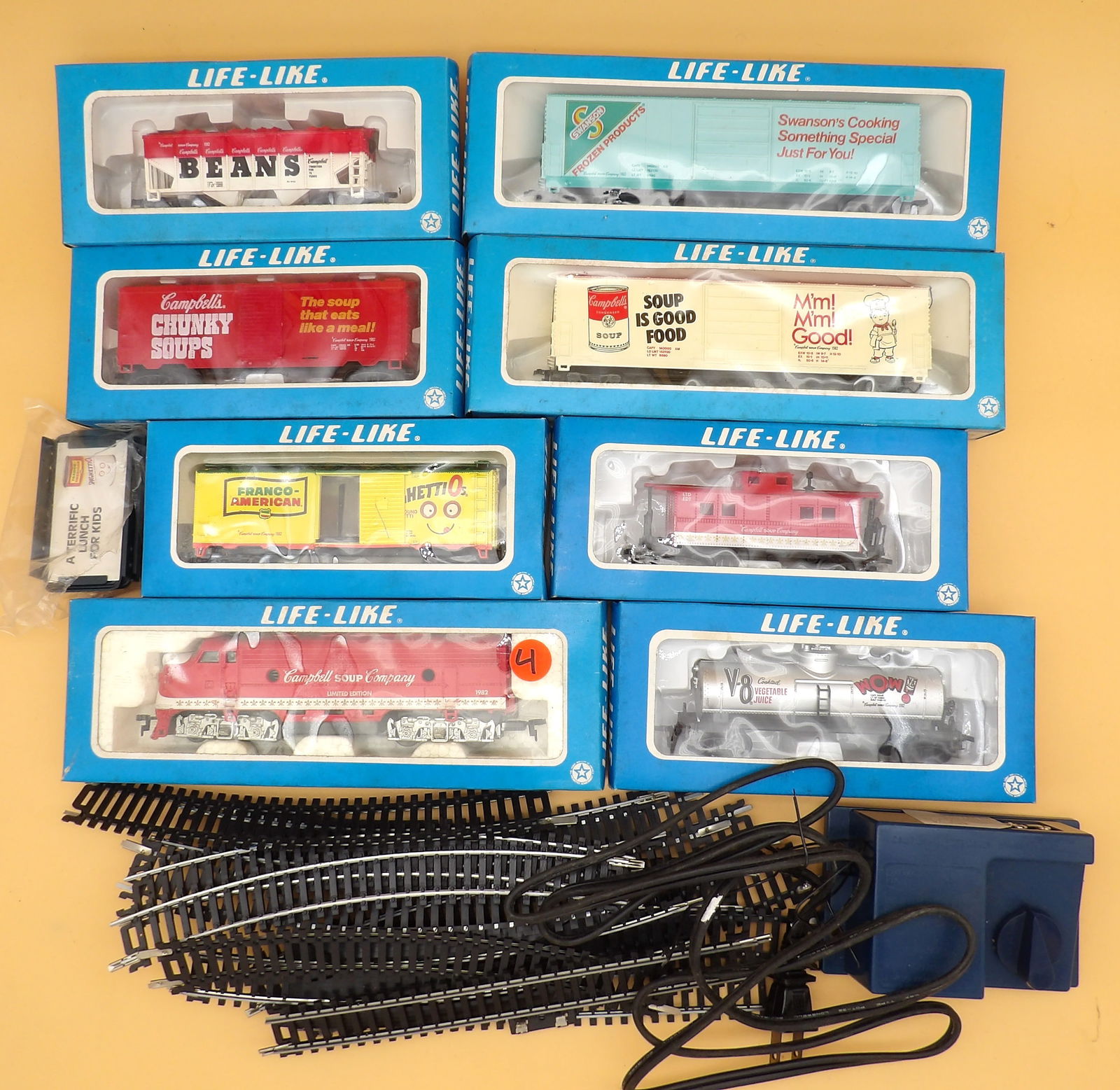 HO Scale "Life-Like" Campbell's Train Cars, Track, Transformer: This vintage H.O. Scale train collection includes 8 train cars (new in box) including Campbell's Soup F7 Locomotive, Franco American Spaghettio's Box Car, Swanson Frozen Products Box Car, Campbell's S