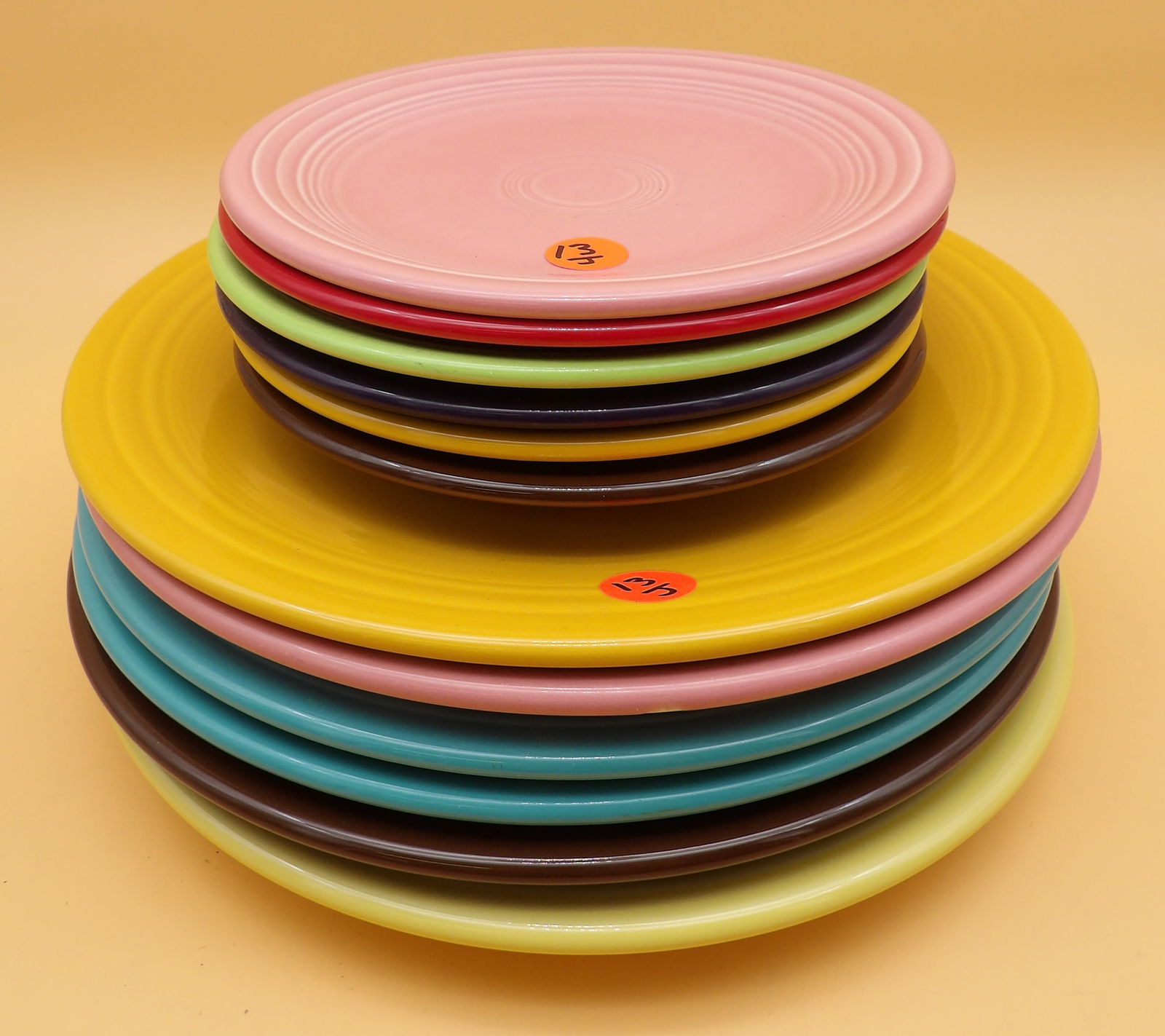 Fiestaware Plates (12): This collection of vibrant modern-era Fiestaware includes six 10" dinner plates and six 7" small plates. Comes in Rose, Scarlet, Plum, Chocolate, Yellow, Turqouise, and Old Ivory glazes.