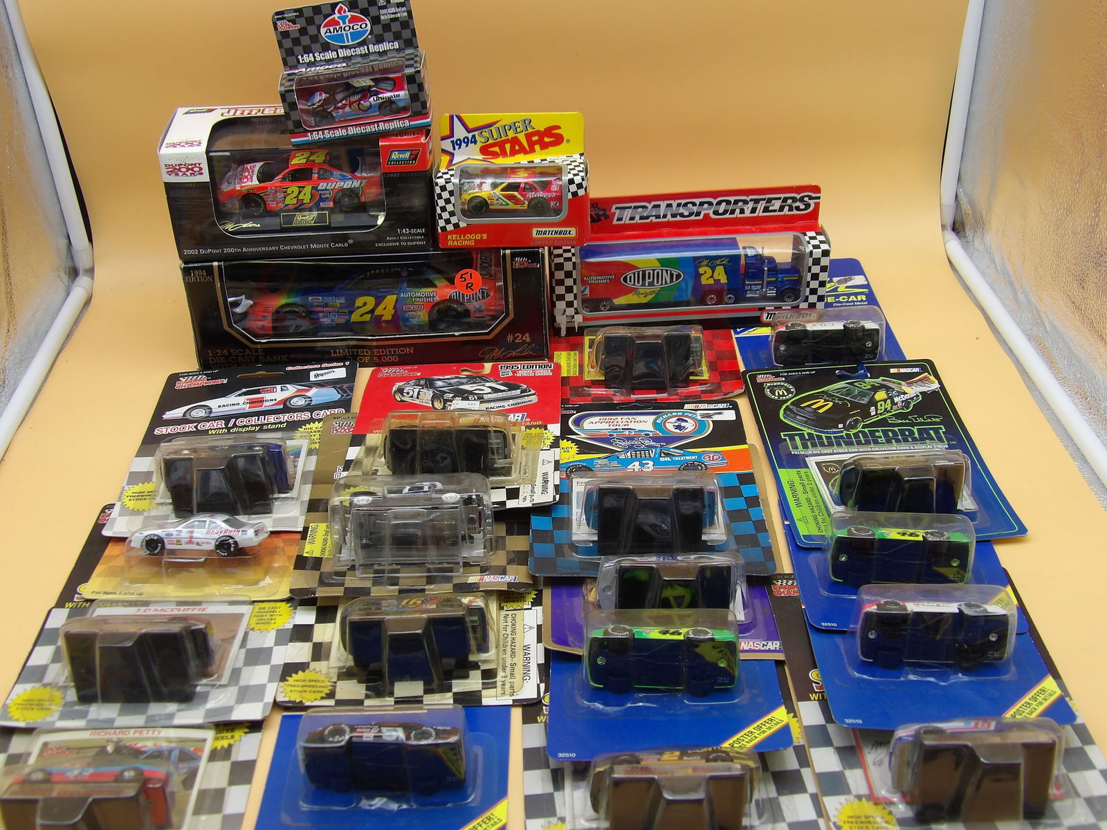 Die Cast NASCAR Race Cars (23 pcs): This collection of 23 sealed/packaged diecast race cars includes Amoco #93 Davce Blaney Autographed car, Racing Champions (Stock Car w/ Collector's Card), Matchbox Days of Thunder, Pole Position,