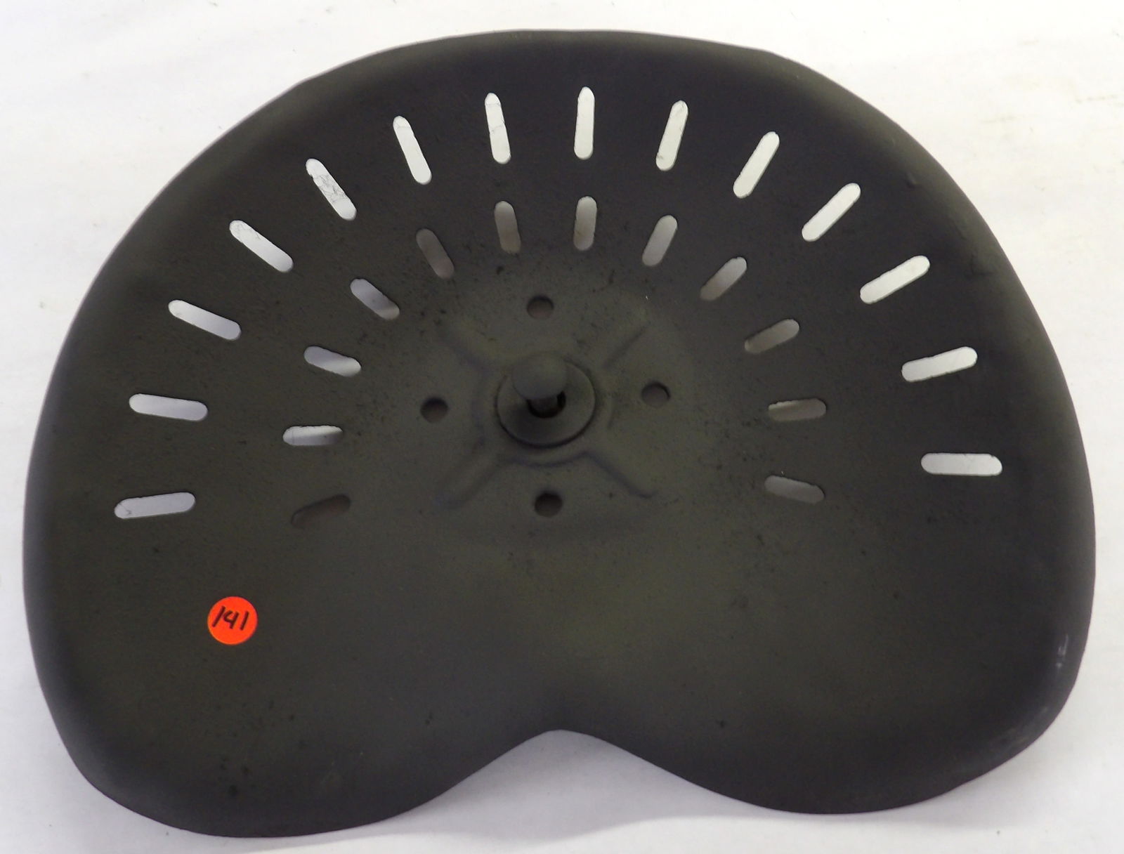 Vintage Tractor Seat: This vintage iron tractor seat measures 16.5" x 13.5" x 3".