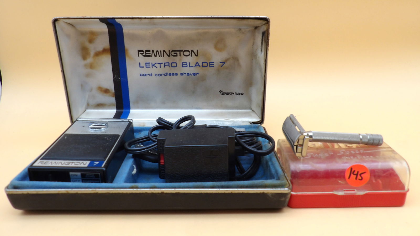 Gillette Super Speed One Piece Razor & Remington Lektro Blade 7 Shaver: This lot includes a vintage Gillette Super Speed One Piece Razor (in plastic case - 1.5" x 4" x 2") and a Remington Lektro Blade 7 Cord - Cordless Shaver (w/ power adapter, replacement blades, and