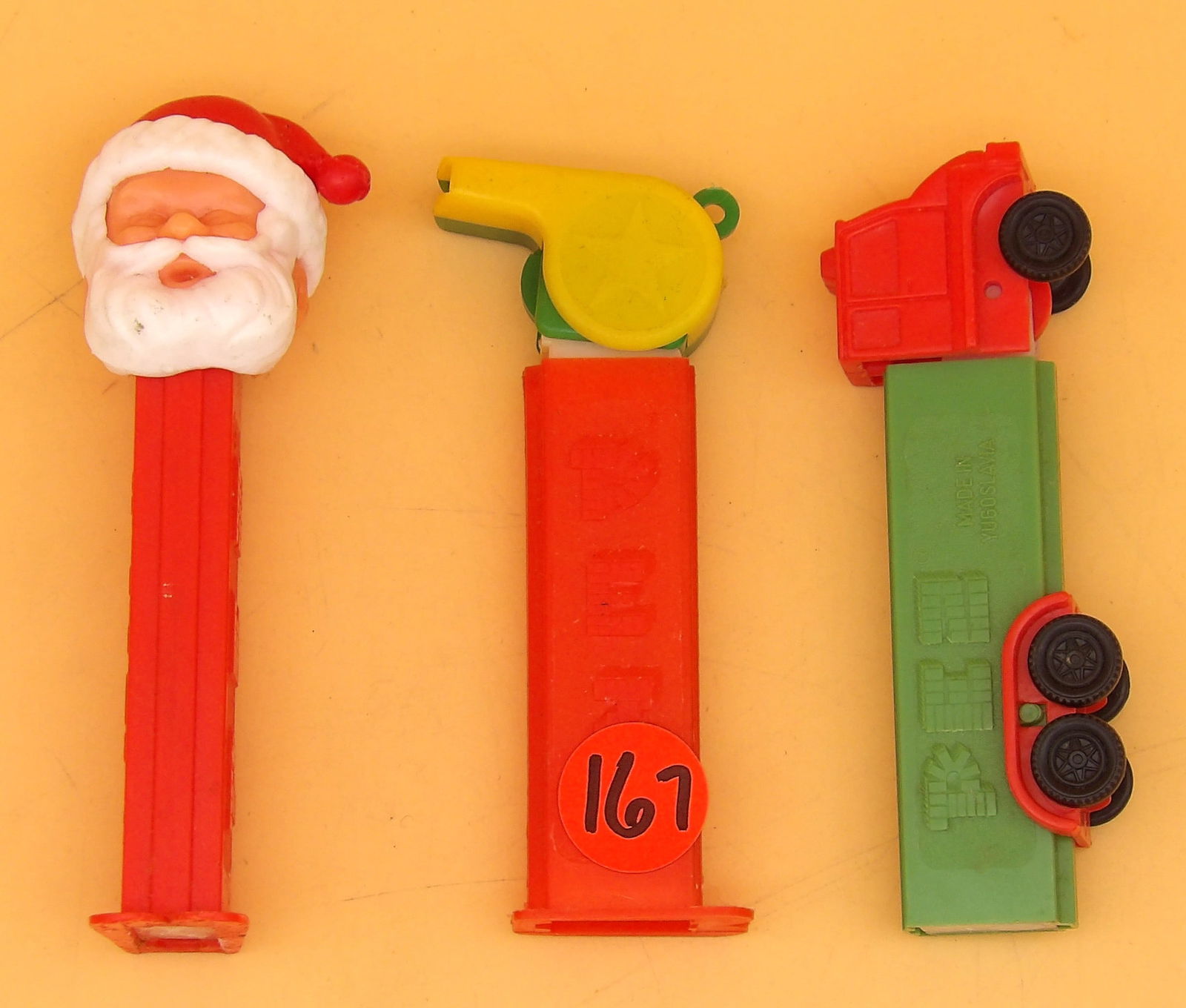 Vintage PEZ Despensers (3): This trio of collectible 1970's era PEZ despensers includes a truck, whistle, and Santa. Measures 4" each.