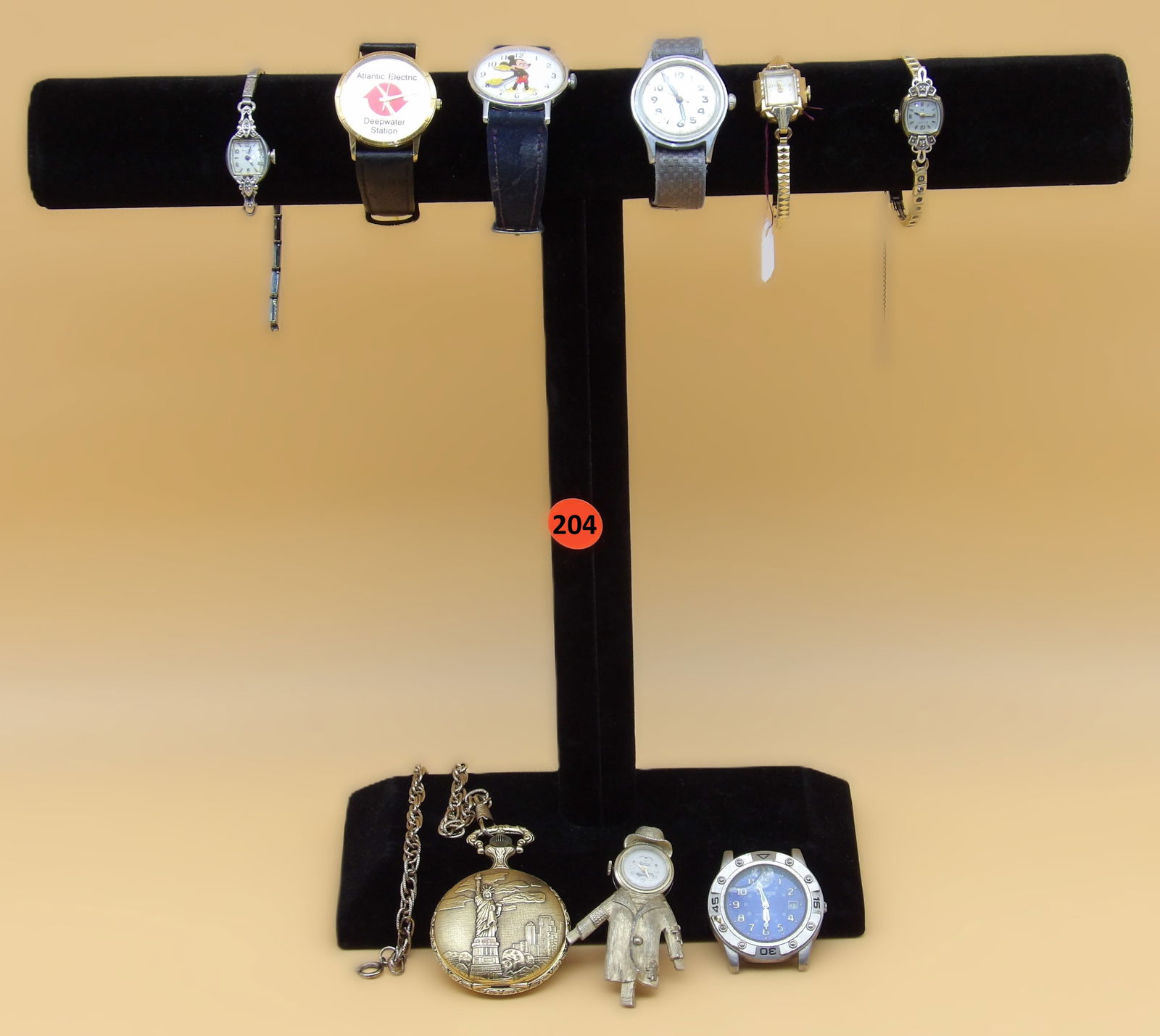 Watch Lot: This watch lot includes a Mickey Mouse, Bulova, Vantime (scarecrow pin), Seeland Incabloc, Wrangler (glass cracked), Atlantic Electric Deepwater Station, Commemorative Limited Edition Pocketwatch. 197