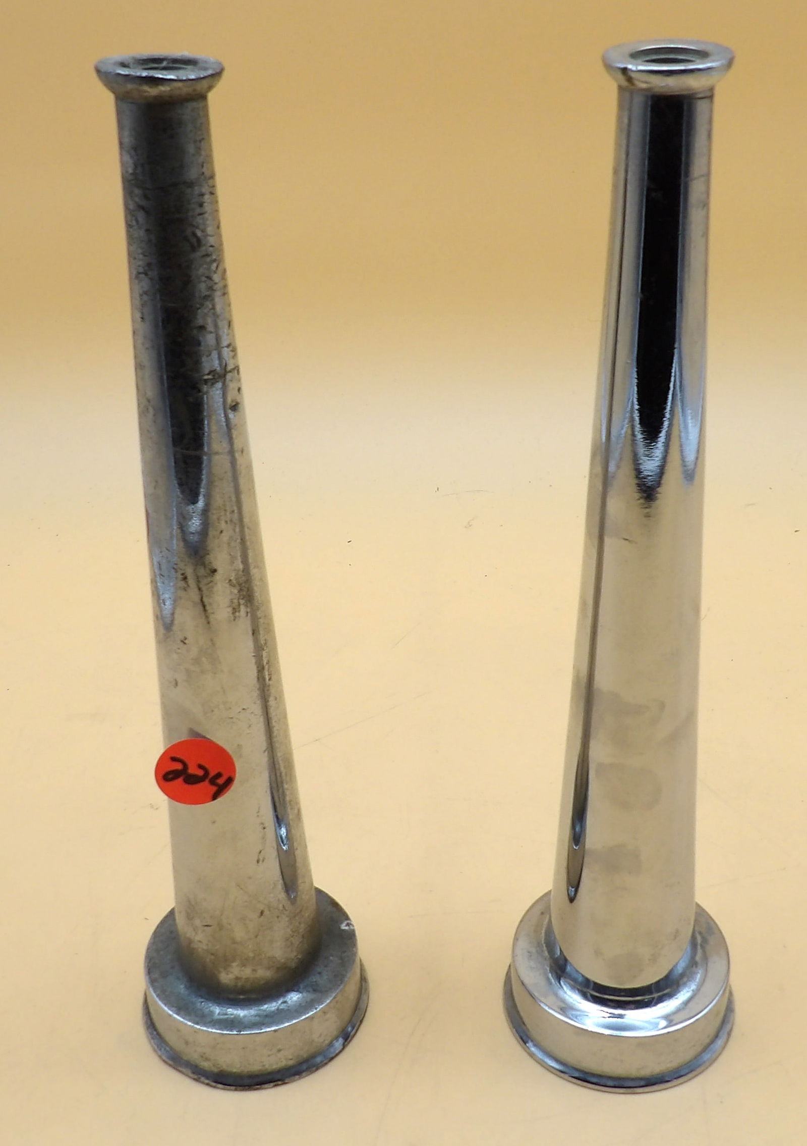 Vintage Steel Fire Hose Nozzle Heads (2): This pair of vintage steel fire hose nozzle head attachments measures 10" each.