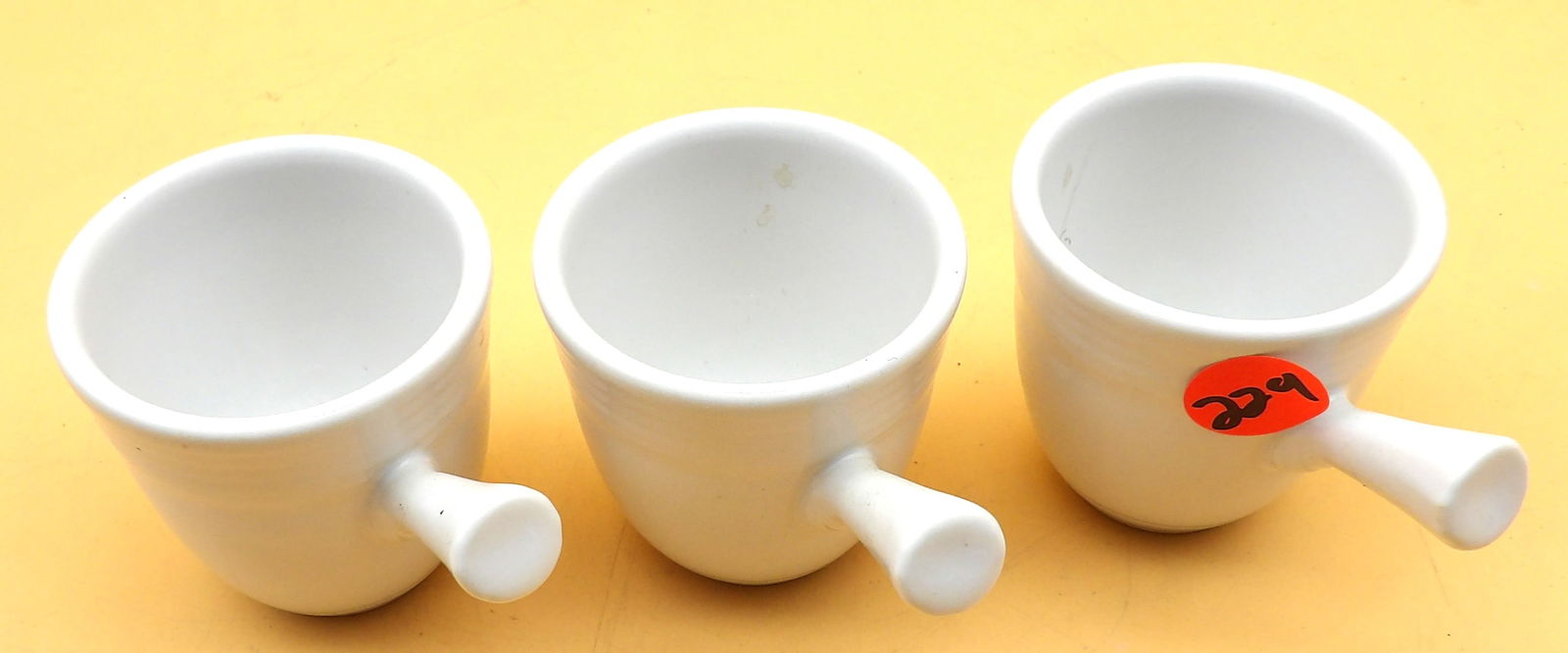Fiestaware Demitasse Cups (3): This trio of white Fiestaware demitasse cups feature stick handle and measure 2" x 3.5".