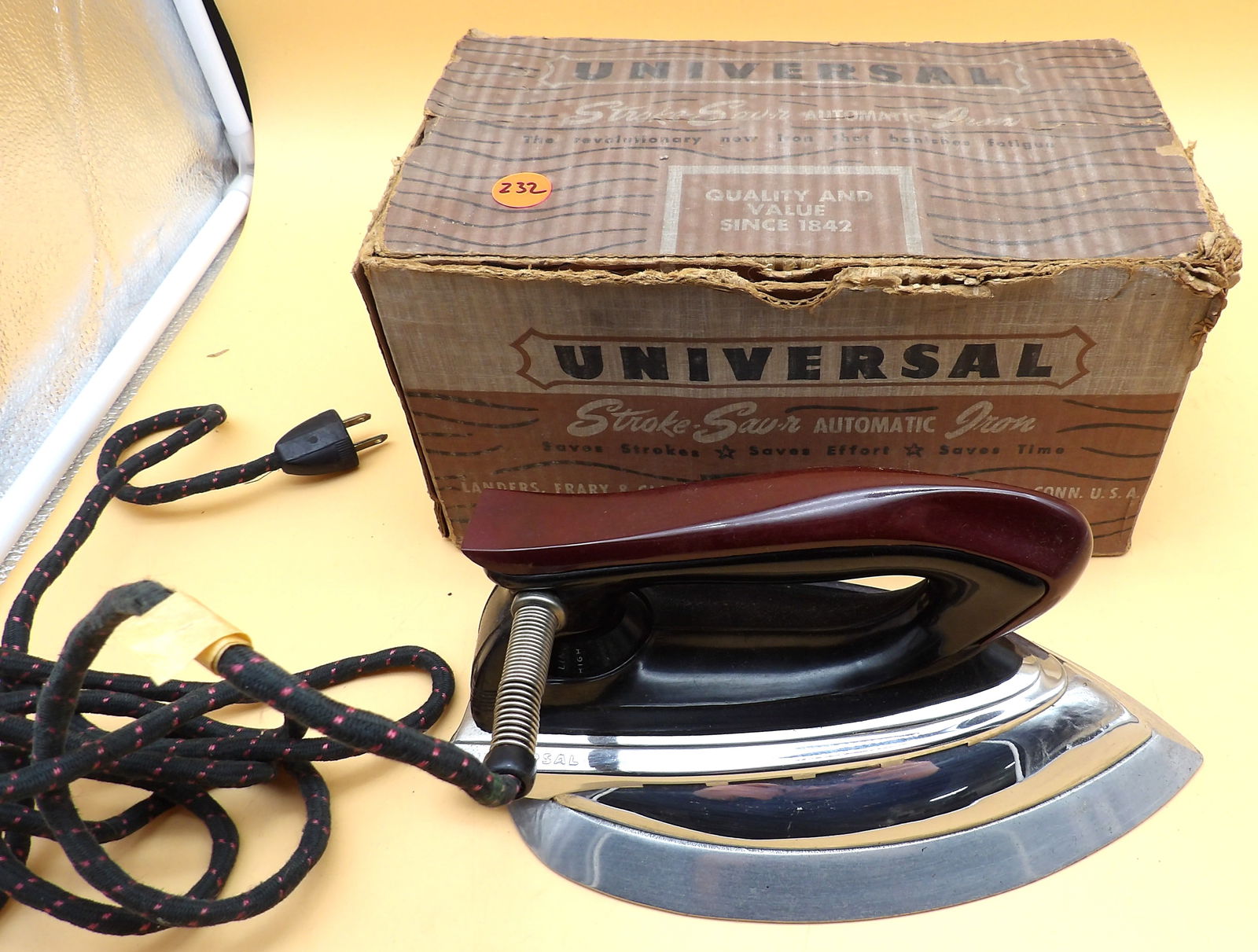 Universal Stroke-Savr Automatic Iron: This clothing iron, manufactured by Universal (Landers, Frary & Clark) commonly known as "the Stewardess" for its compact intuitive design and ease of use, has a beautifully crafted wood handle in exc