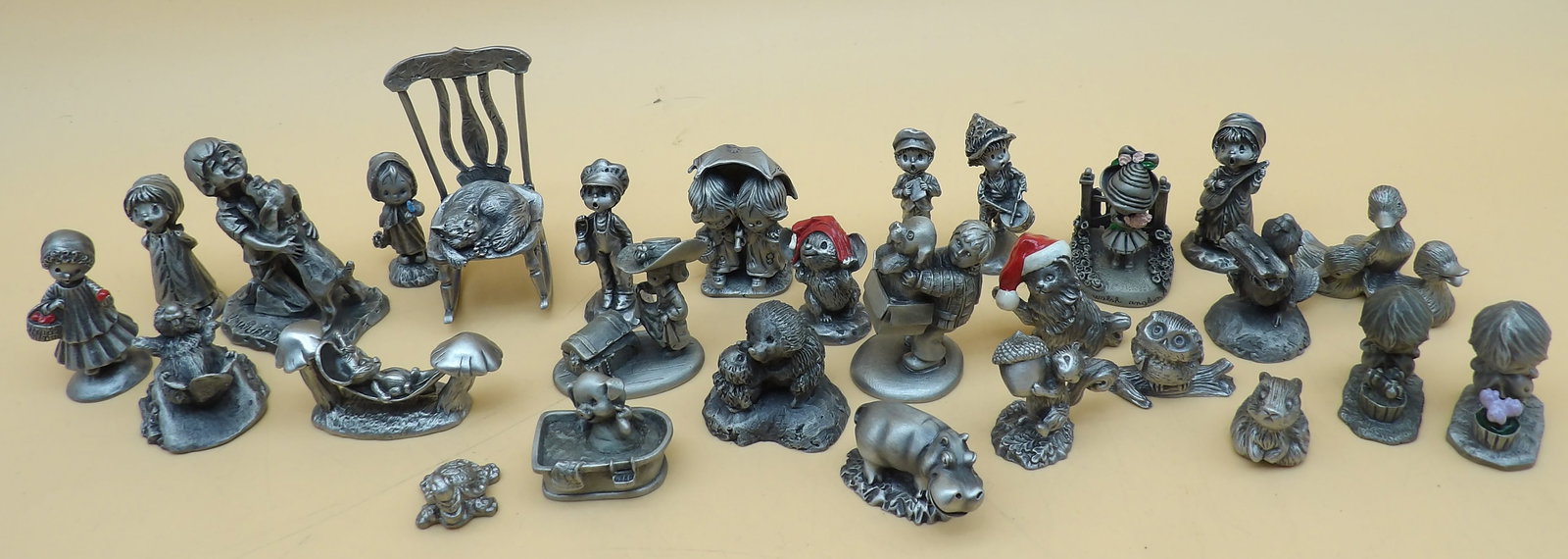 Hallmark Little Gallery Pewter Figurines (28 pcs): This collection of 28 collectible pewter figurines is made by Hallmark Little Gallery (1970's & 1980's) and features whimsical children and animals at play. These remain popular and highly prized