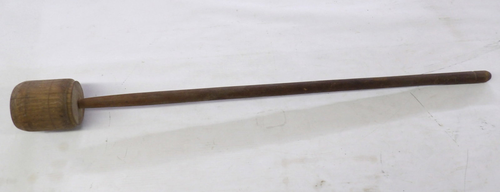 Antique Primitive Wood Masher Tool: This primitive wooden masher, often referred to as a pestle or stomper, was used for crushing food items in large containers. Measures approx 36" in length.