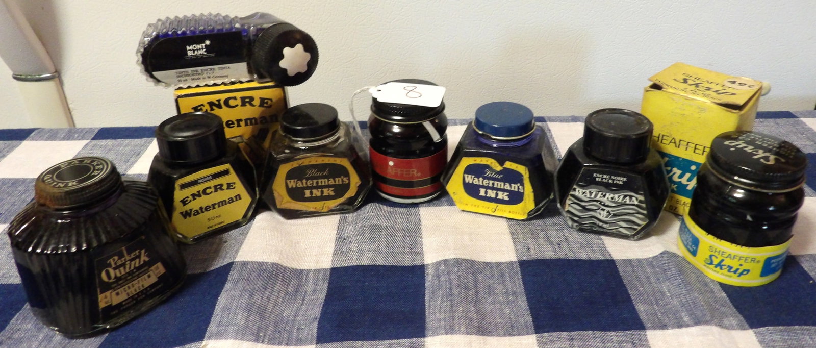 Lot of Vintage Ink Wells (8): This collection of vintage inkwells includes Parker Quink, Sheaffer Skrip, Waterman, Mont Blanc (8 total & 2 w/boxes).