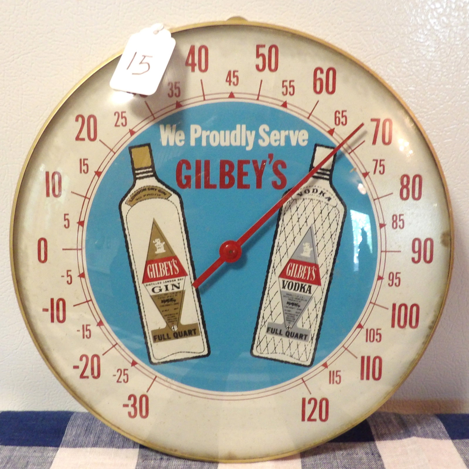 Gibley's Metal Thermometer Display: This Gilbey's Gin & Vodka metal thermometer is a round advertising piece w glass face. Measures 9.5"