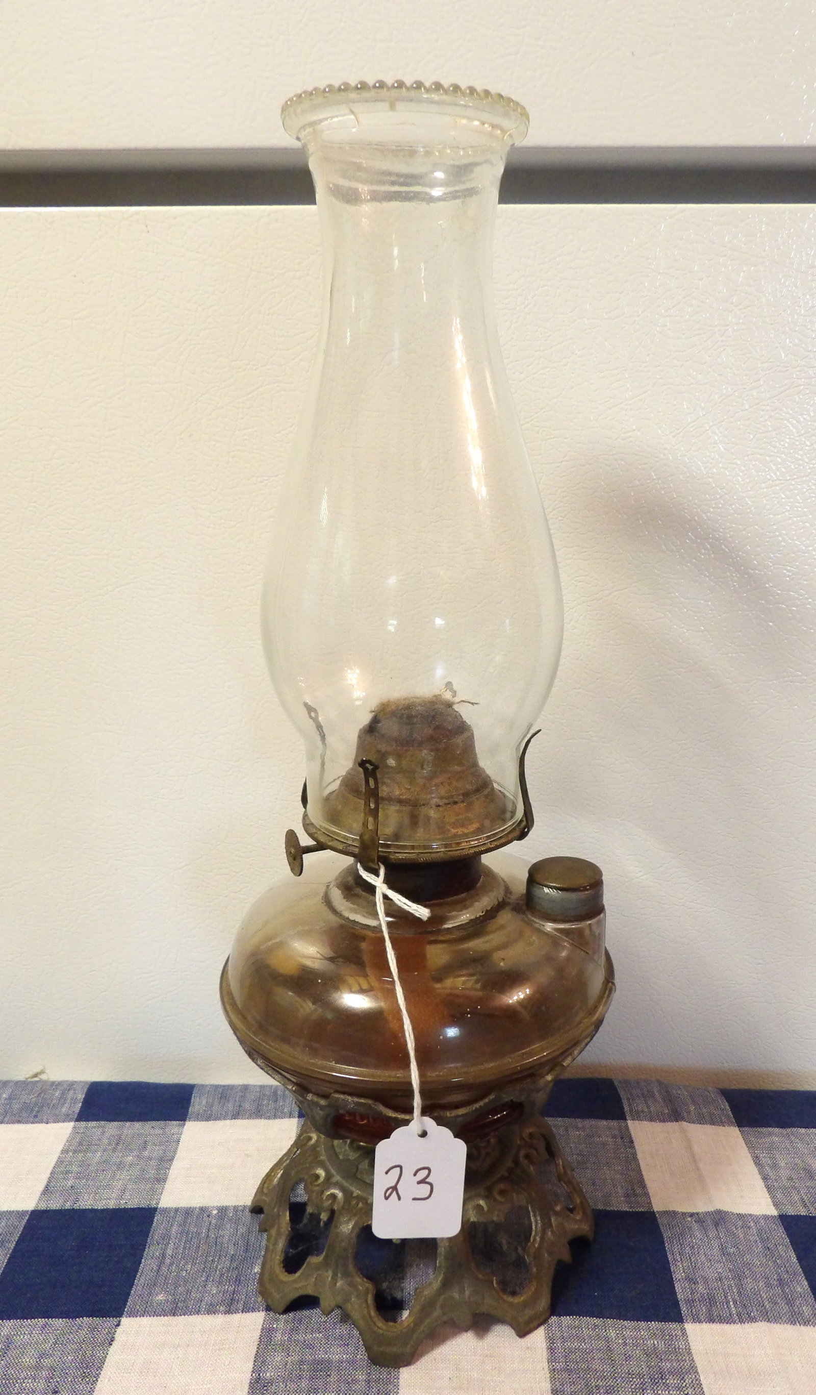 Banner Oil Lamp: This antique Banner oil lamp measures 15.5" x 5.5"