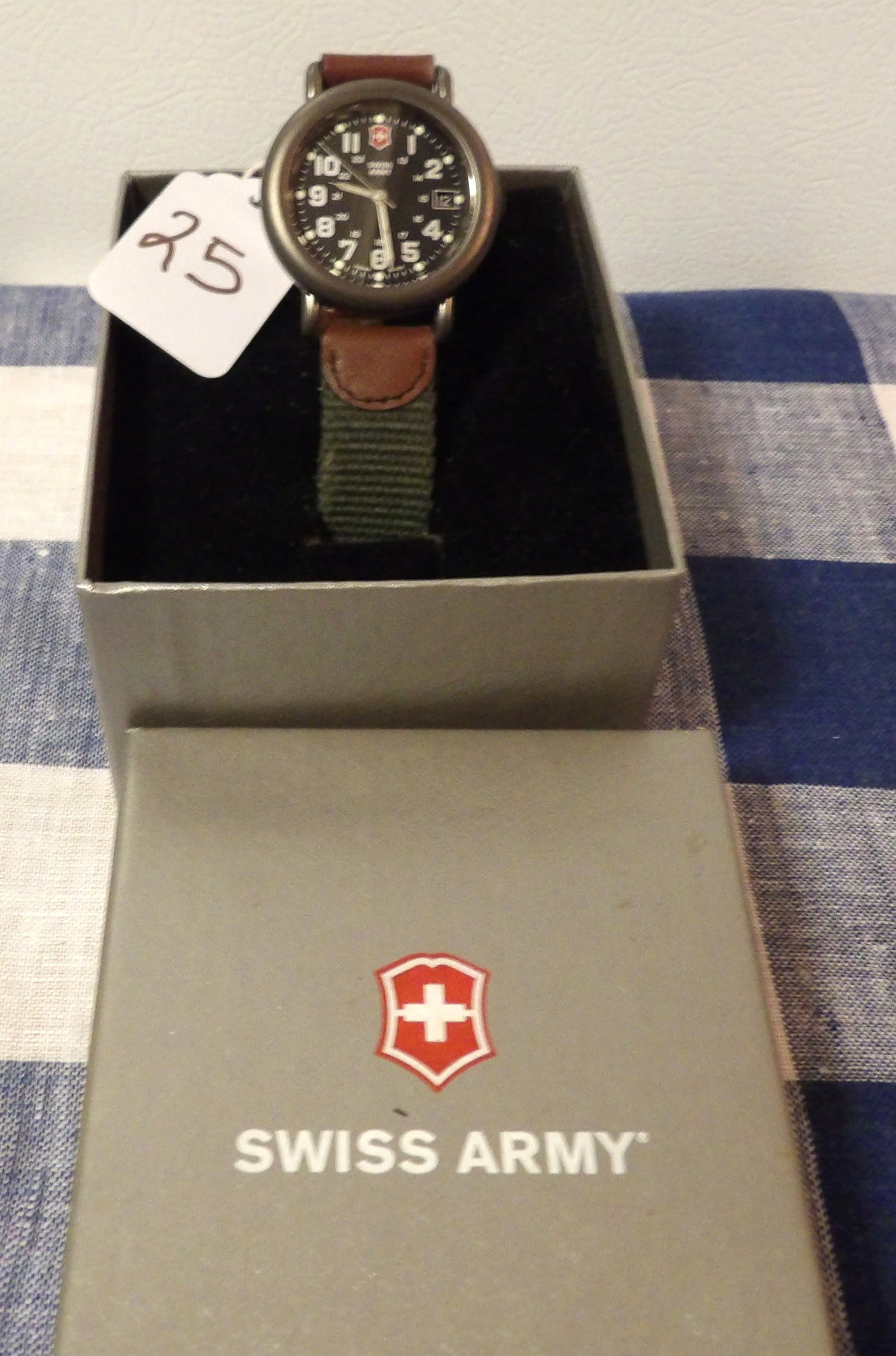 Swiss Army Wrist Watch: This Victorinox Swiss Army Cavalry wrist watch is New In Box (NOS - New Old-Stock) and is water resistent. Box measures 3.5" x 2.75" x 4.25"