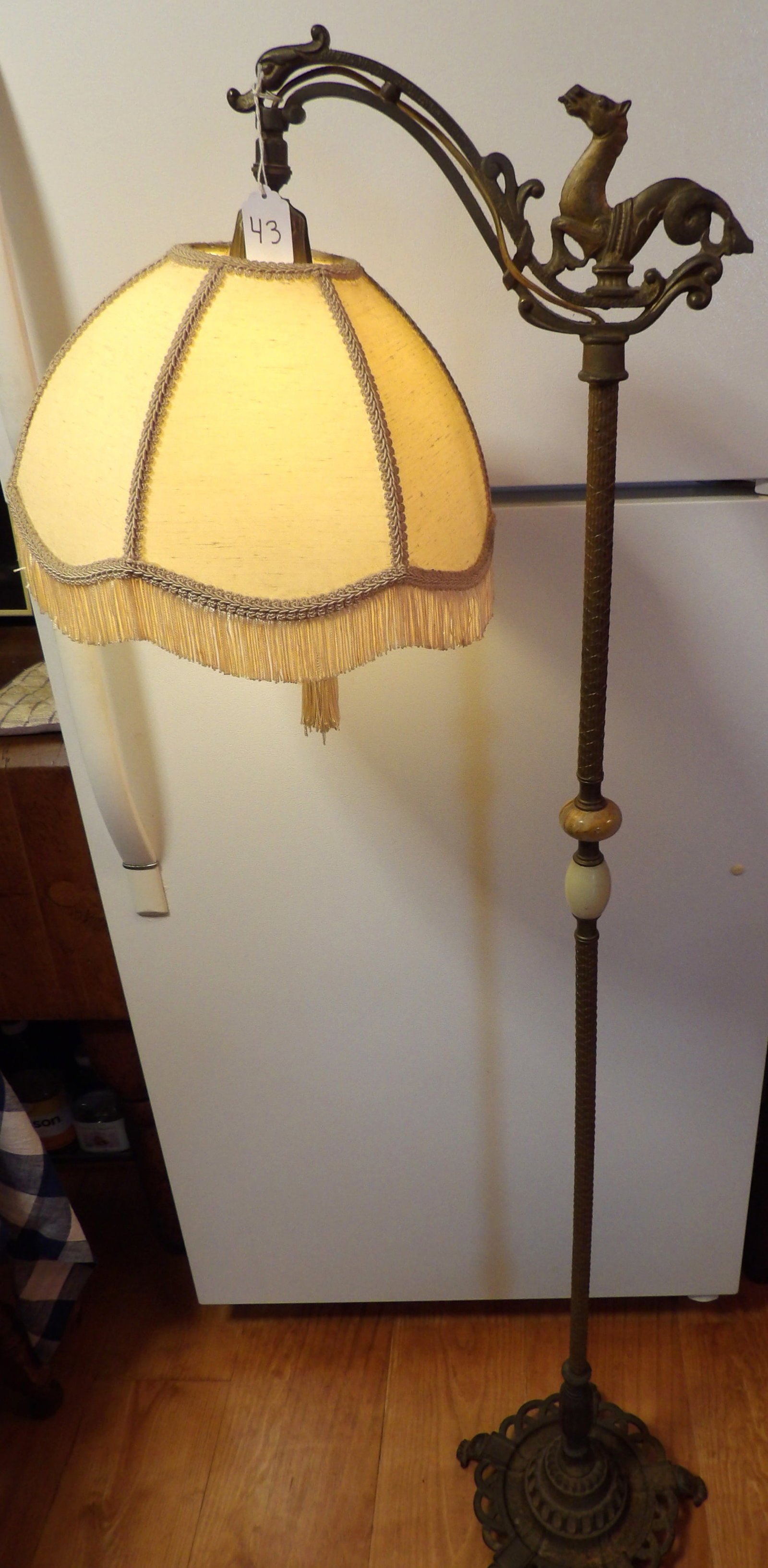Rembrandt Bridge Floor Lamp: This vintaeg Rembrandt Bridge floor lamp features an ornate cast iron base and a mythical horse figure on top. Measures 58" tall. *NO SHIPPING AVAILABLE ON THIS ITEM - PICK UP ONLY
