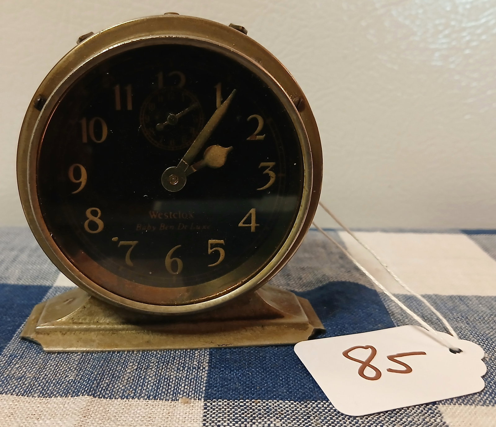 Westclox Baby Ben Alarm Clock: This vintage Westclox Baby Ben De Luxe wind-up alarm clock features a black dial with a distinctive polished nickel or chrome case
