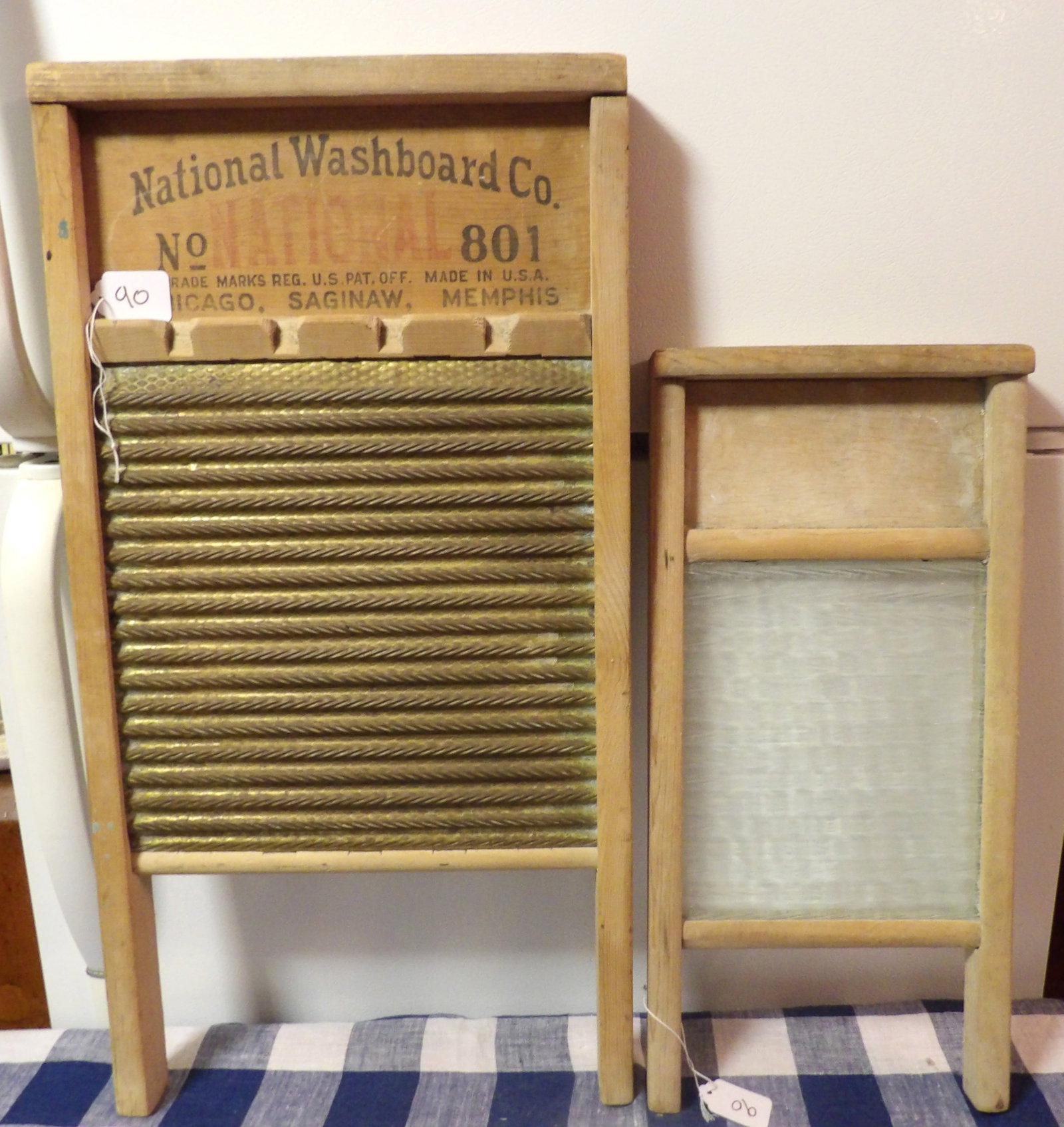 Metal & Glass Washboards (2): This pair of vintage washboards includes 1 Metal (National Washboard Co) and 1 Glass (unmarked). Measures 24" x 13" & 18" x 9"