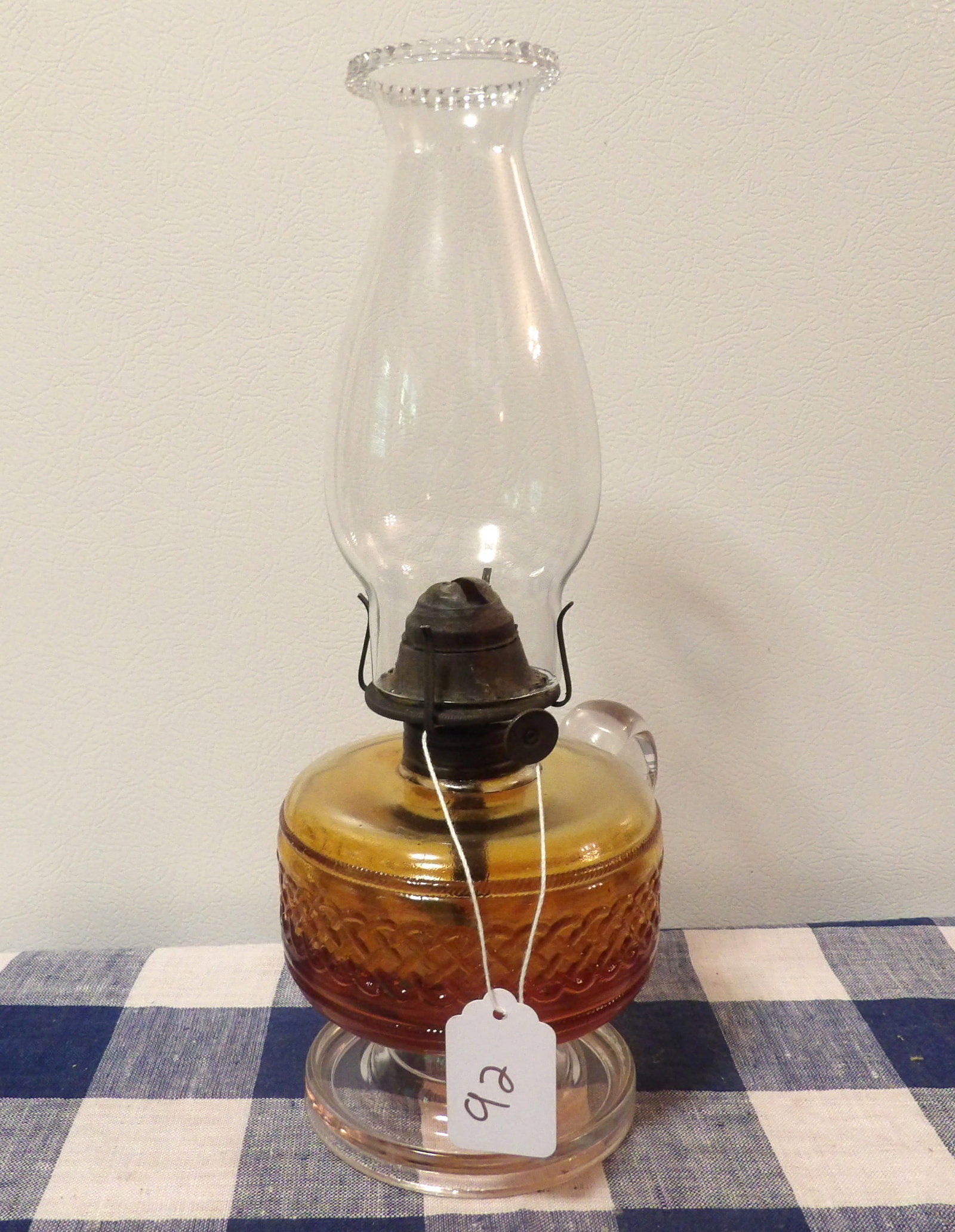 Glass Oil Lamp: This antique oil lamp features a glass body and chimney. Measures 12" x 6" NO SHIPPING ON THIS ITEM - PICK UP ONLY