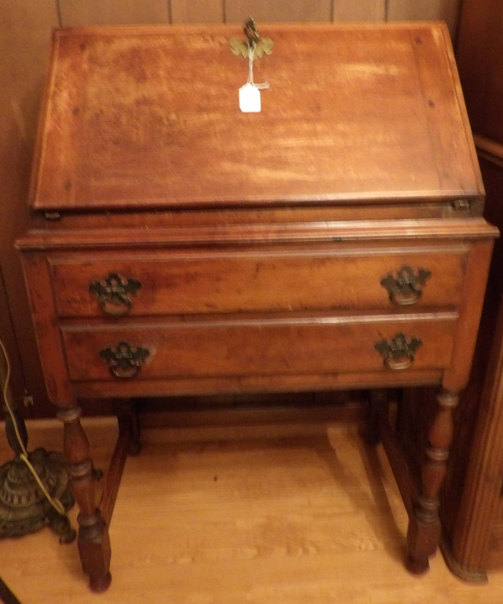 Front Drop Wooden Secretary Desk: This Colonial-style front dropleaf secretary's desk includes leaf key and inside drawers / compartments. Measures 39" x 26" x 16"