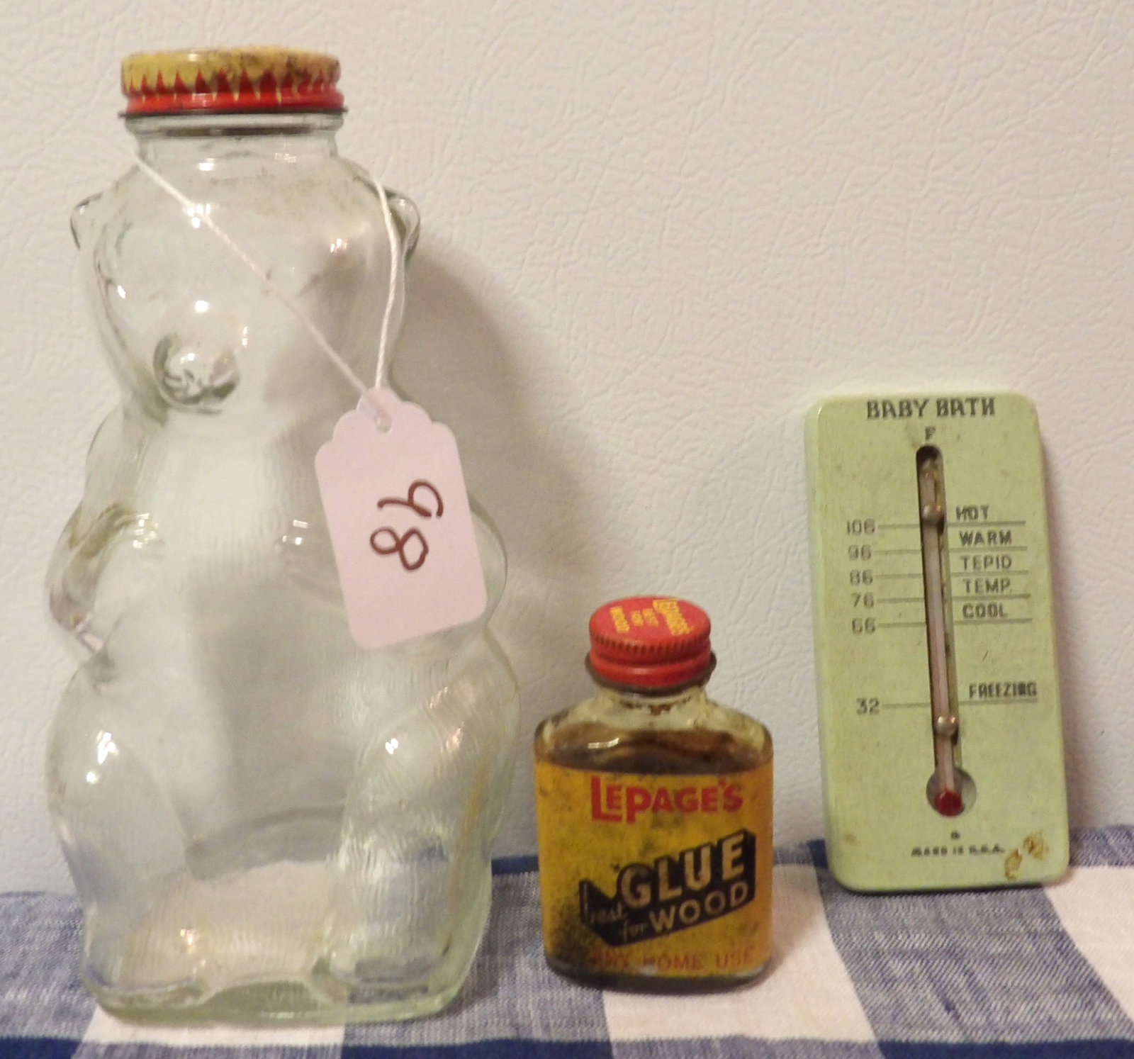 Snow Crest Bear Jar, Lepage's Wood Glue Bottle, Baby Bath Thermometer: This lot features a Snow Crest Bear Jar, a Lepage's Wood Glue Bottle, and a vintage Baby Bath Thermometer. Measures 8", 3", 5"