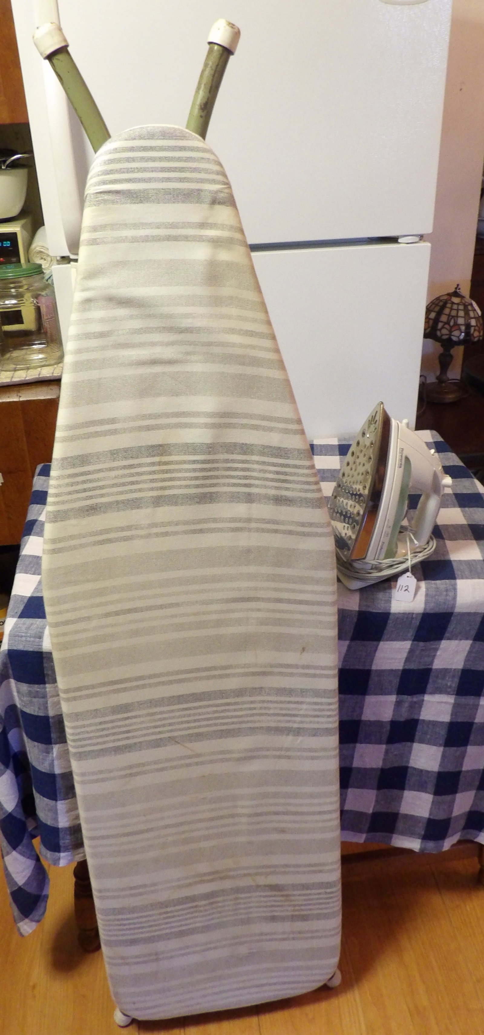 Ironing Board & Electric Steam Iron: This lot includes a vintage ironing board and electric steam iron. Measures 54.5" Long, 12" x 5" *NO SHIPPING AVAILABLE FOR THIS ITEM - PICK UP ONLY