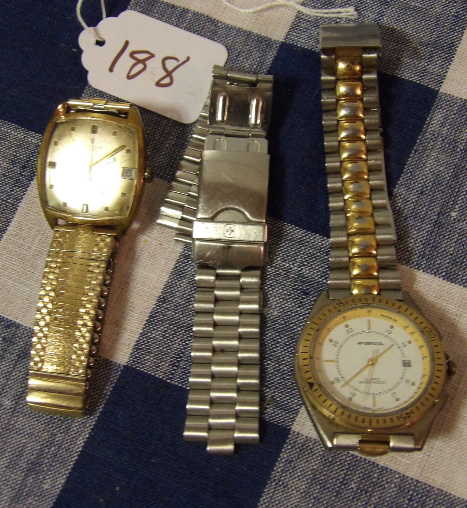 McGregor Quartz Water Resistant Watch, Junghans Watch, Watch Band (3 pcs): This 3 piece lot includes a McGregor Quartz Water Resistant Watch, a Junghans Watch, and a watch band