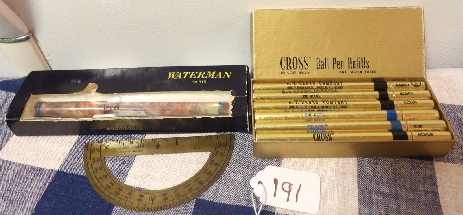Waterman Fountain Pen, Cross Ball Pen Refills (12 tubes), Brass Protractor: This lot includes a Waterman Fountain Pen, Cross Ball Pen Refills (12 tubes), and a vintage Brass Protractor.