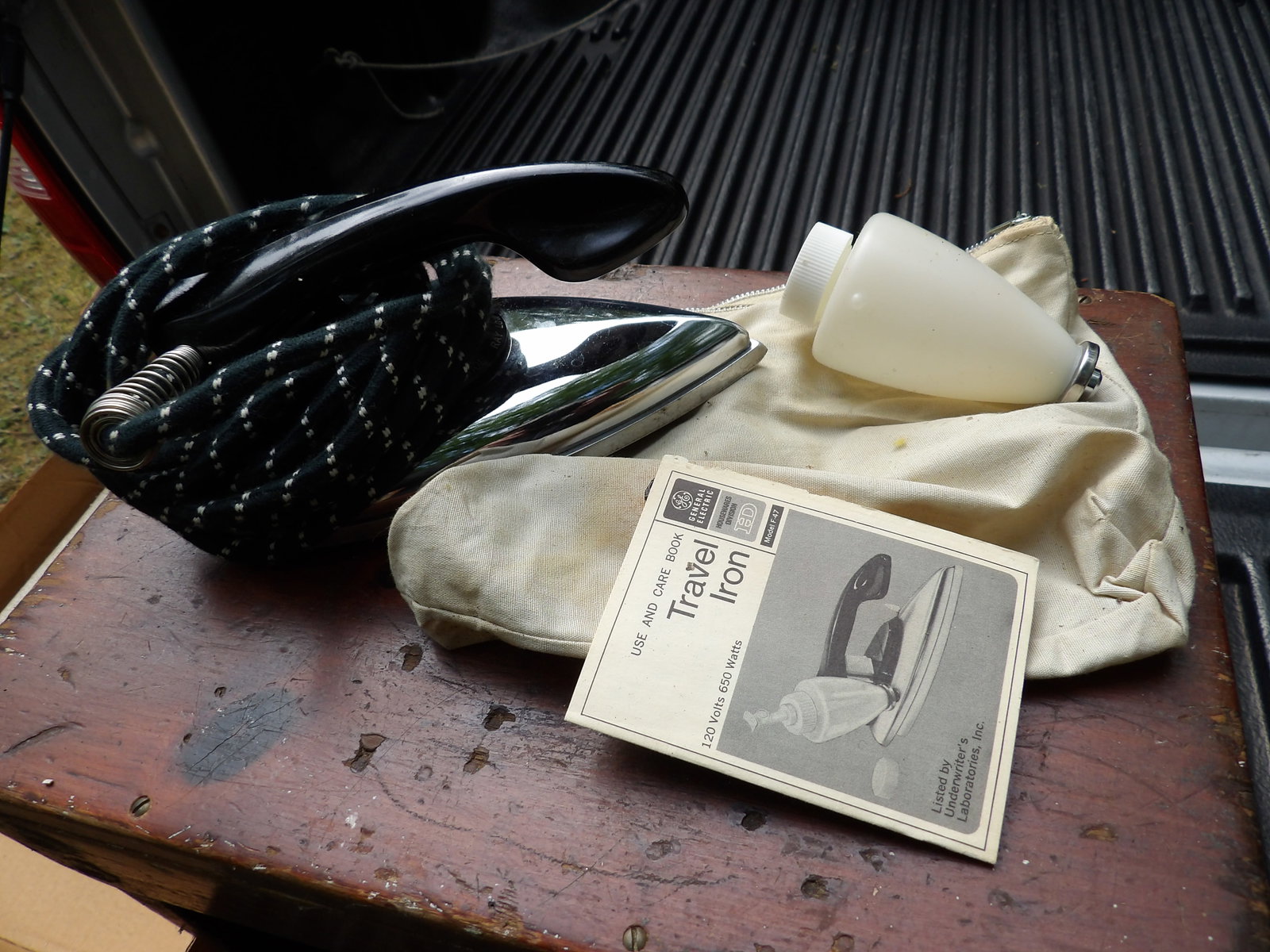 Vintage Travel Iron: This lot features a vintage travel iron w/ instructions