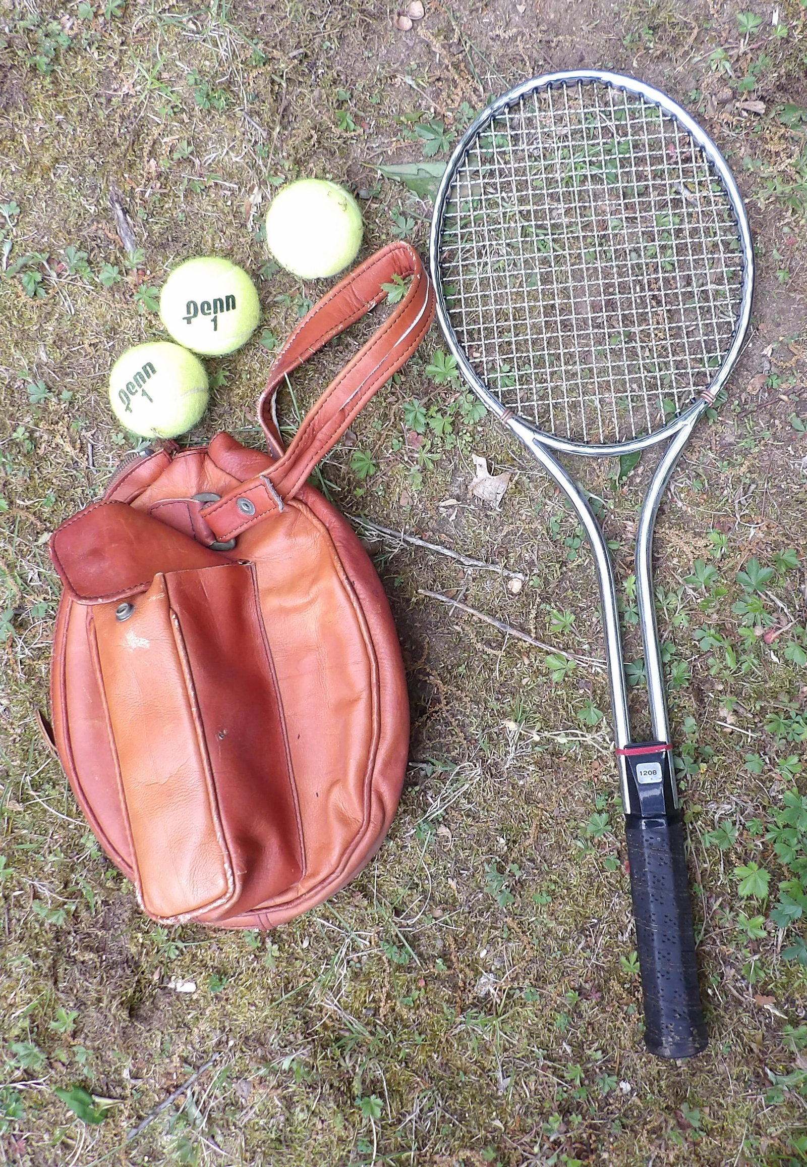 Tennis Racket w/ Leather Case and Balls: This steel-framed tennis racket includes a leather zip case and three tennis balls.