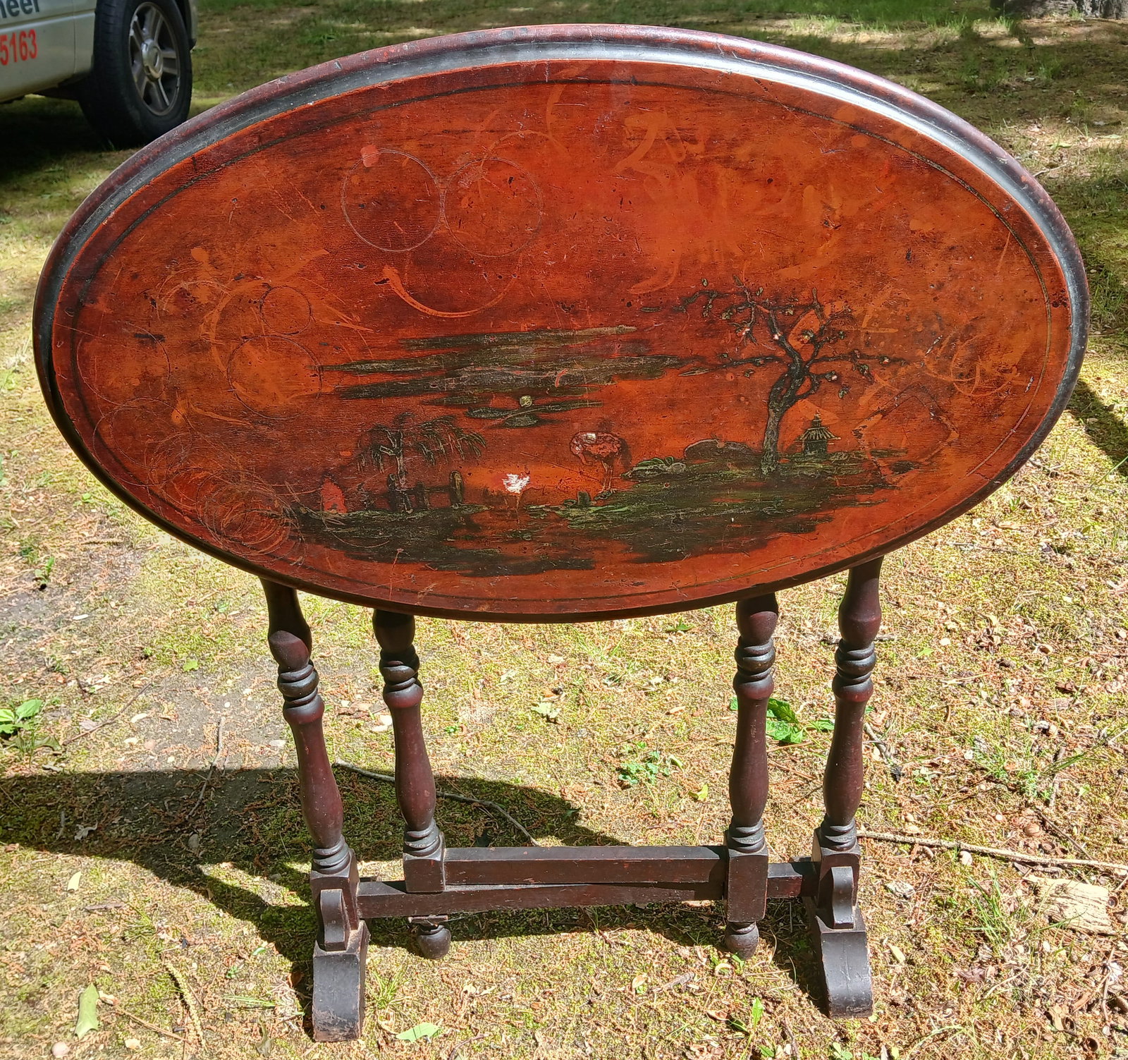 Tilt Top Table: This vintage Tilt Top Table features a landscape scene on the surface. NO SHIPPING AVAILABLE FOR THIS ITEM - PICK UP ONLY