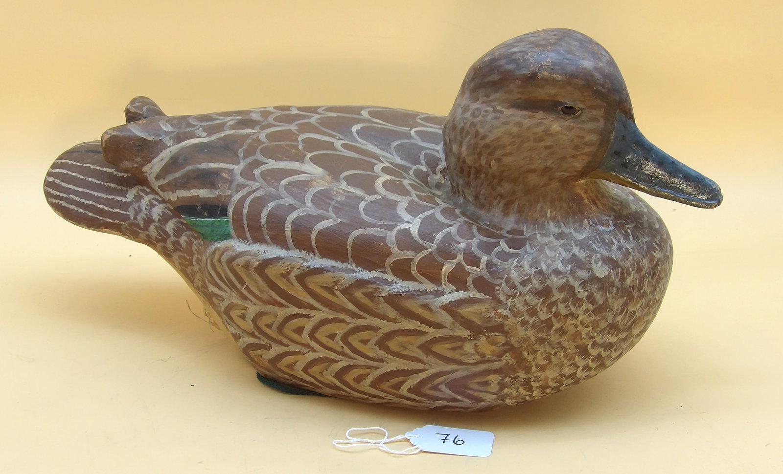 "Teal Hen" Wood Carved Metzger Duck Decoy: This lovely wood carved dcecoy was created by renowned area decoy artist Lawrence Metzger. Measures approx: 9" x 16" x 7"