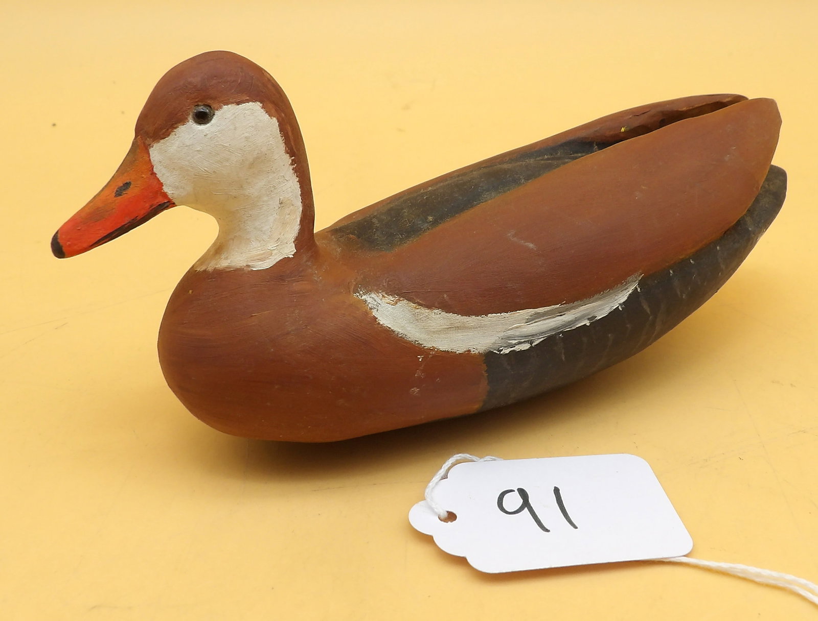 "Black Belly" Wood Carved Metzger Miniature Duck Decoy: This lovingly detailed miniature duck decoy was created by renowned area decoy artist Lawrence Metzger. Measures approx: 2.5" x 6" x 2.5"