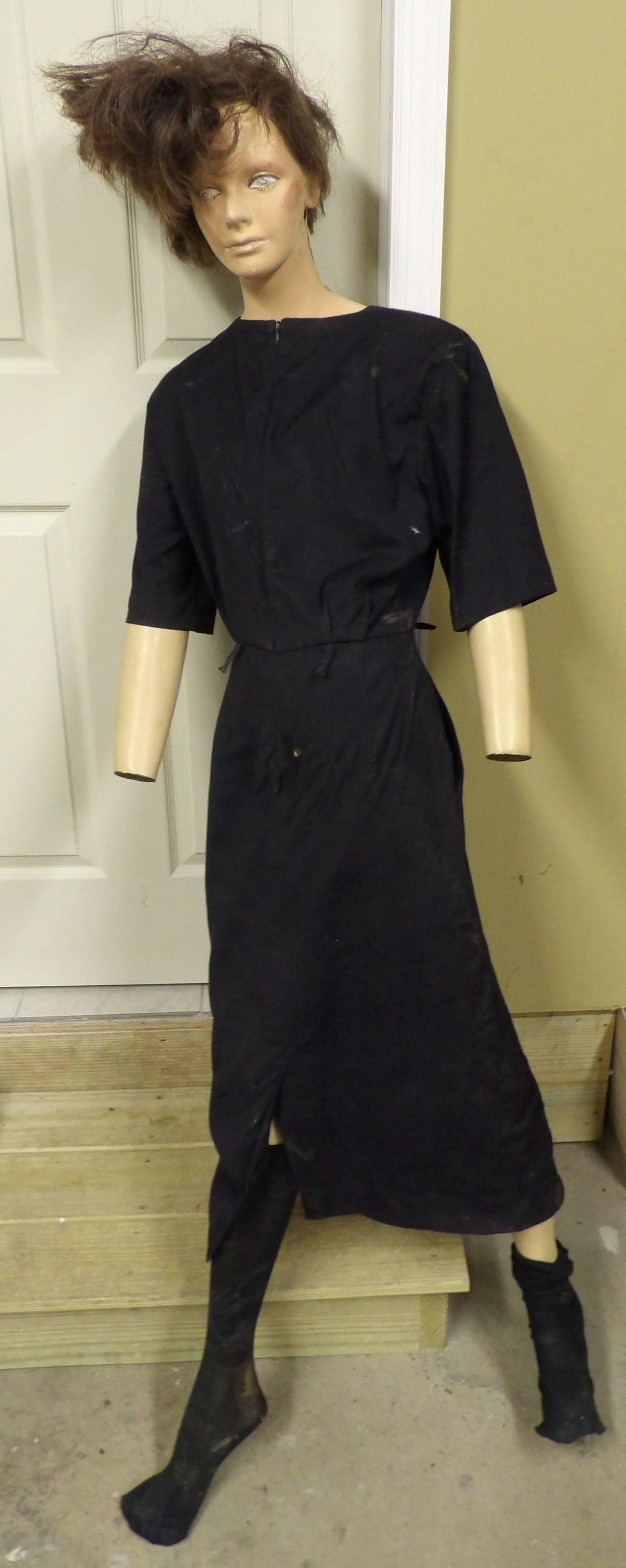 Full Size Display Mannequin: This Full Size Display Mannequin stands approx. 68" and wears a vintage black cinched-waist dress & socks. Limbs and torso are detachable. Crack / damage on side of neck (see photos), but the mannequi