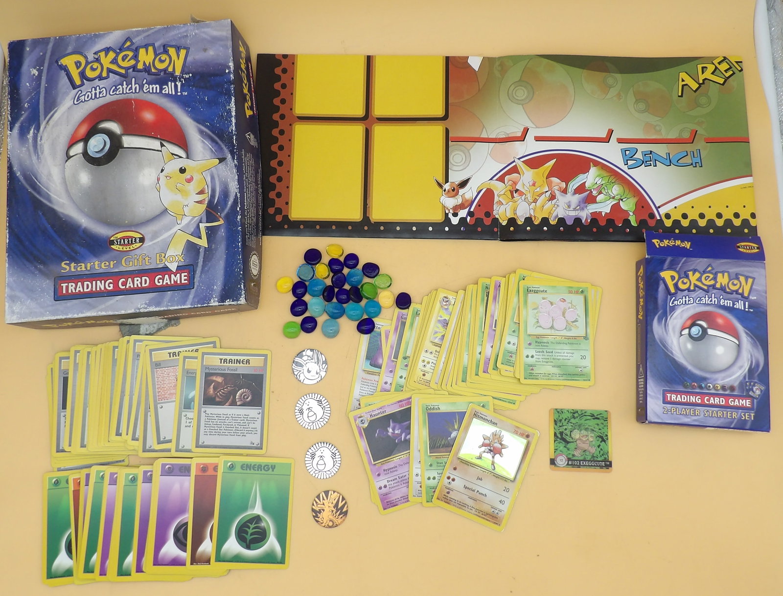 Pokemon Starter Gift Box: This highly coveted vintage 1999 Pokemon Starter Giftbox (Wizards of The Coast) includes 121 Cards, 2 sided play mat, 28 Damage Counter Beads, 4 Game Tokens, and 1 Hologram Card (ArtBox). Cards are no