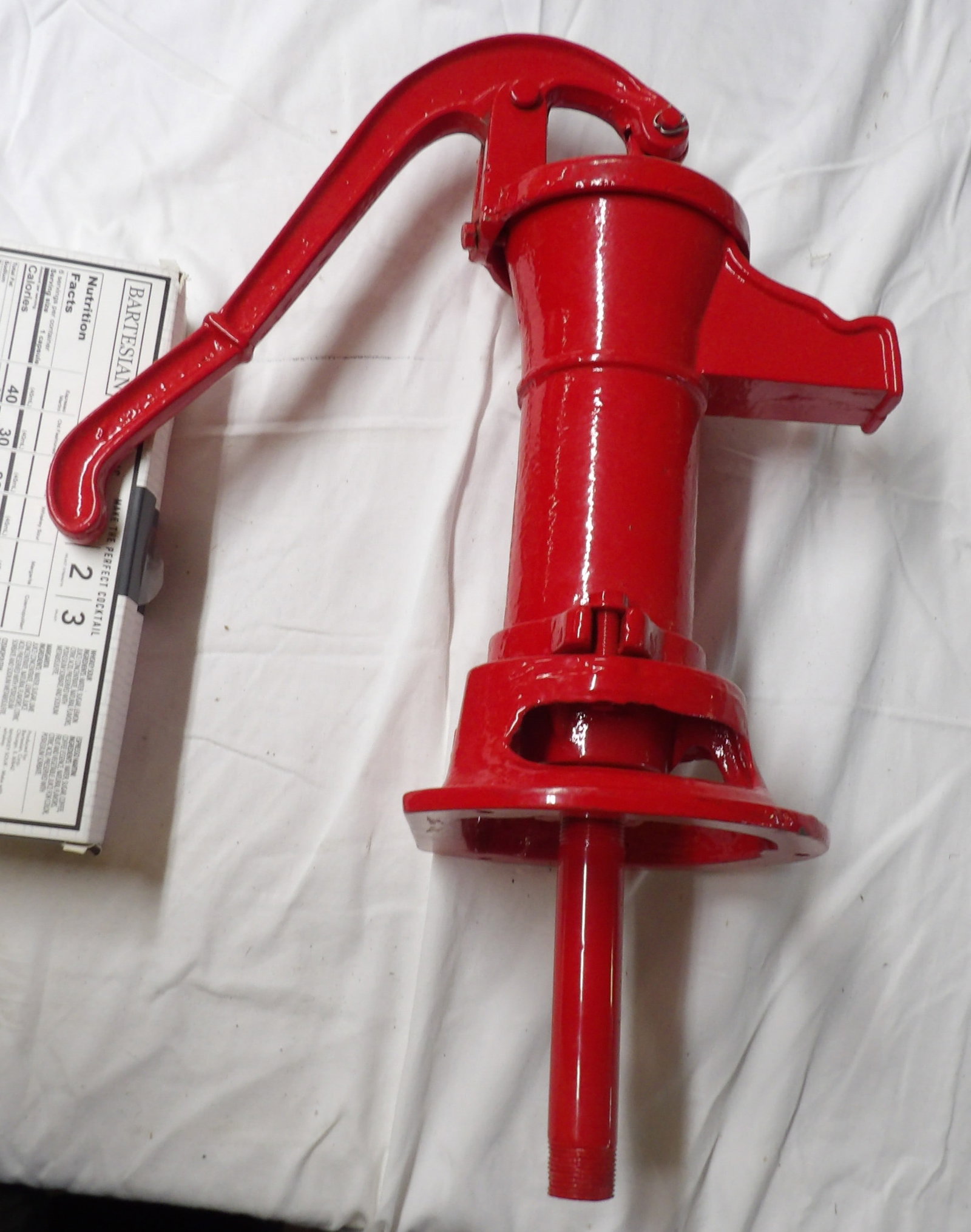 Cast Iron Water Pump Head: This cast iron water pump head is painted brilliant red and measures approx 21" x 11". NO SHIPPING AVAILABLE FOR THIS ITEM - PICK UP ONLY
