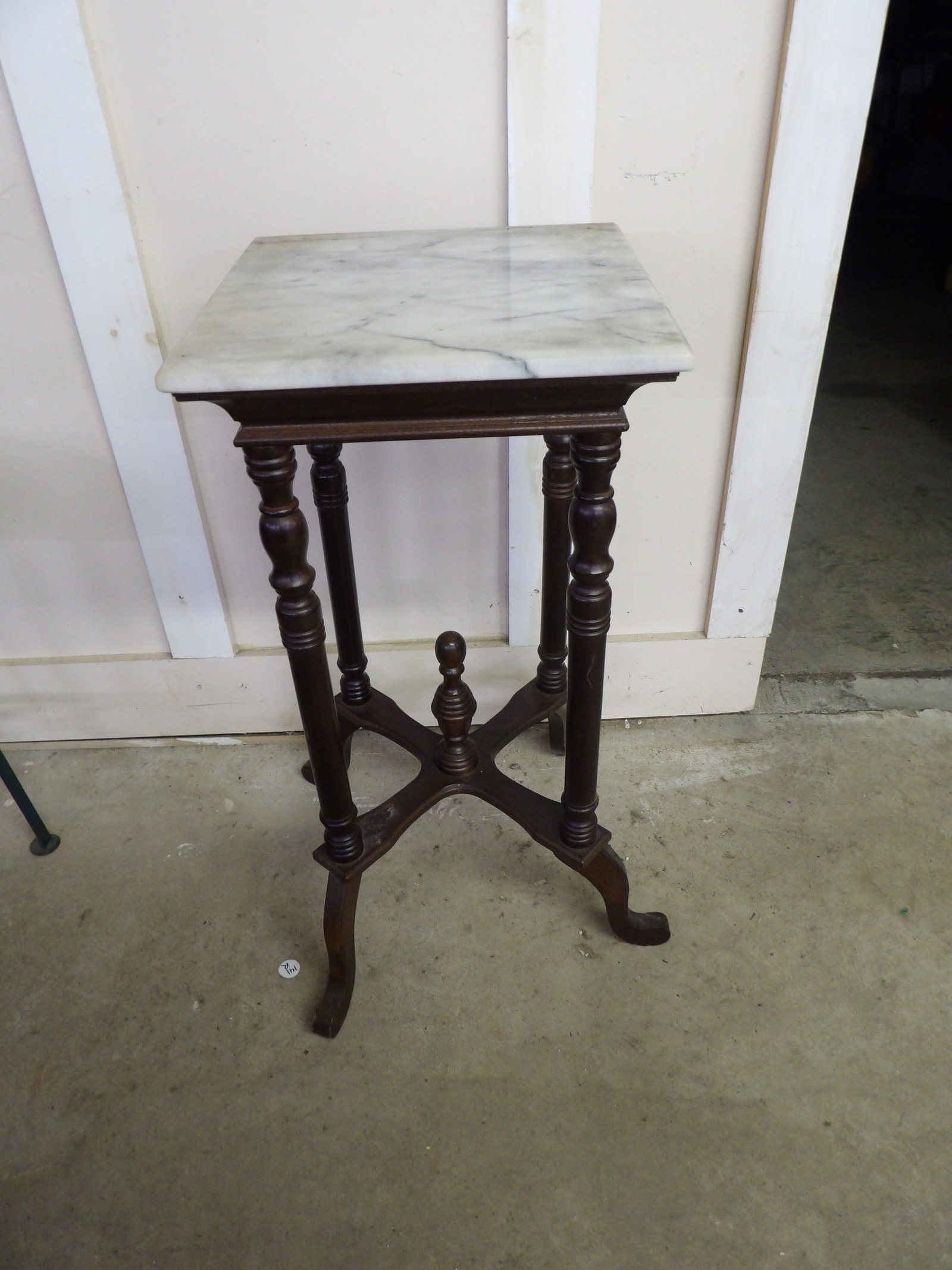 Victorian Revival Marble Top Plant Stand: This Victorian revival marble top plant standfeatures a dark mahogany wood base with turned legs. Measures approx 29" x 14" x 14". NO SHIPPING AVAILABLE ON THIS ITEM - PICK UP ONLY