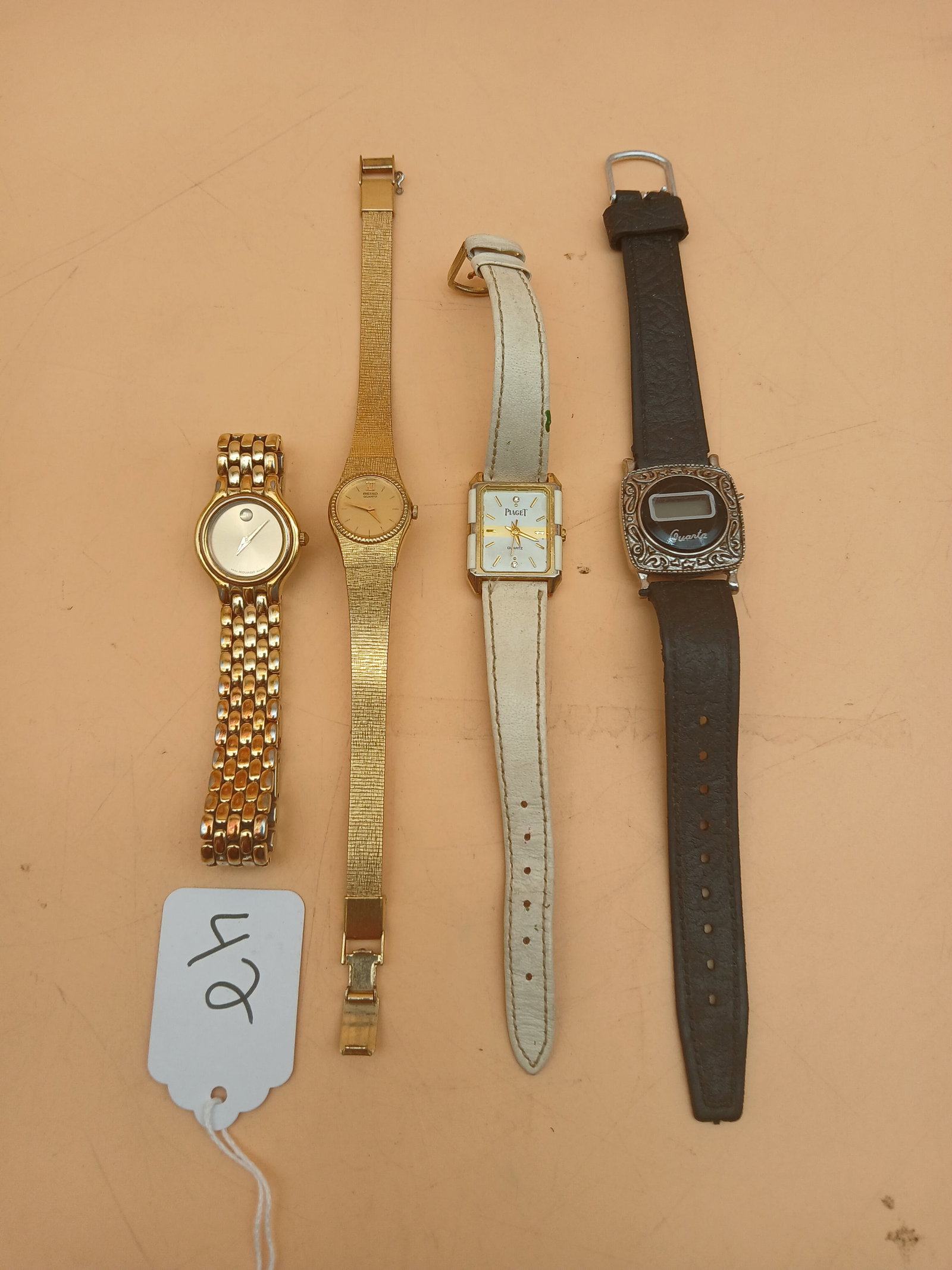 Wrist Watch Lot (4): This lot of 4 wristwatches includes Movado, Seiko, Piaget, and Quartz.