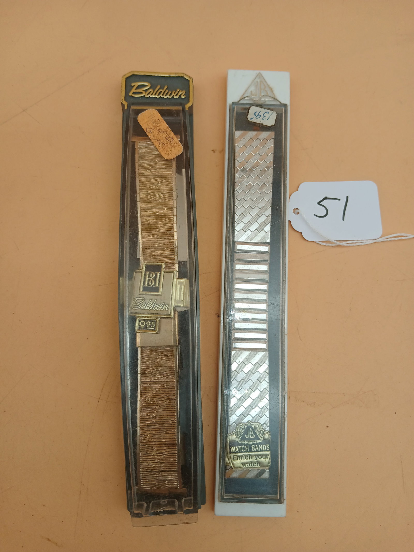Baldwin & JB Watch Bands NOS: This pair of vintage NOS watch bands includes a Baldwin and a JB - both unused in original cases. Measures approx 7.5" x 1" each in case.