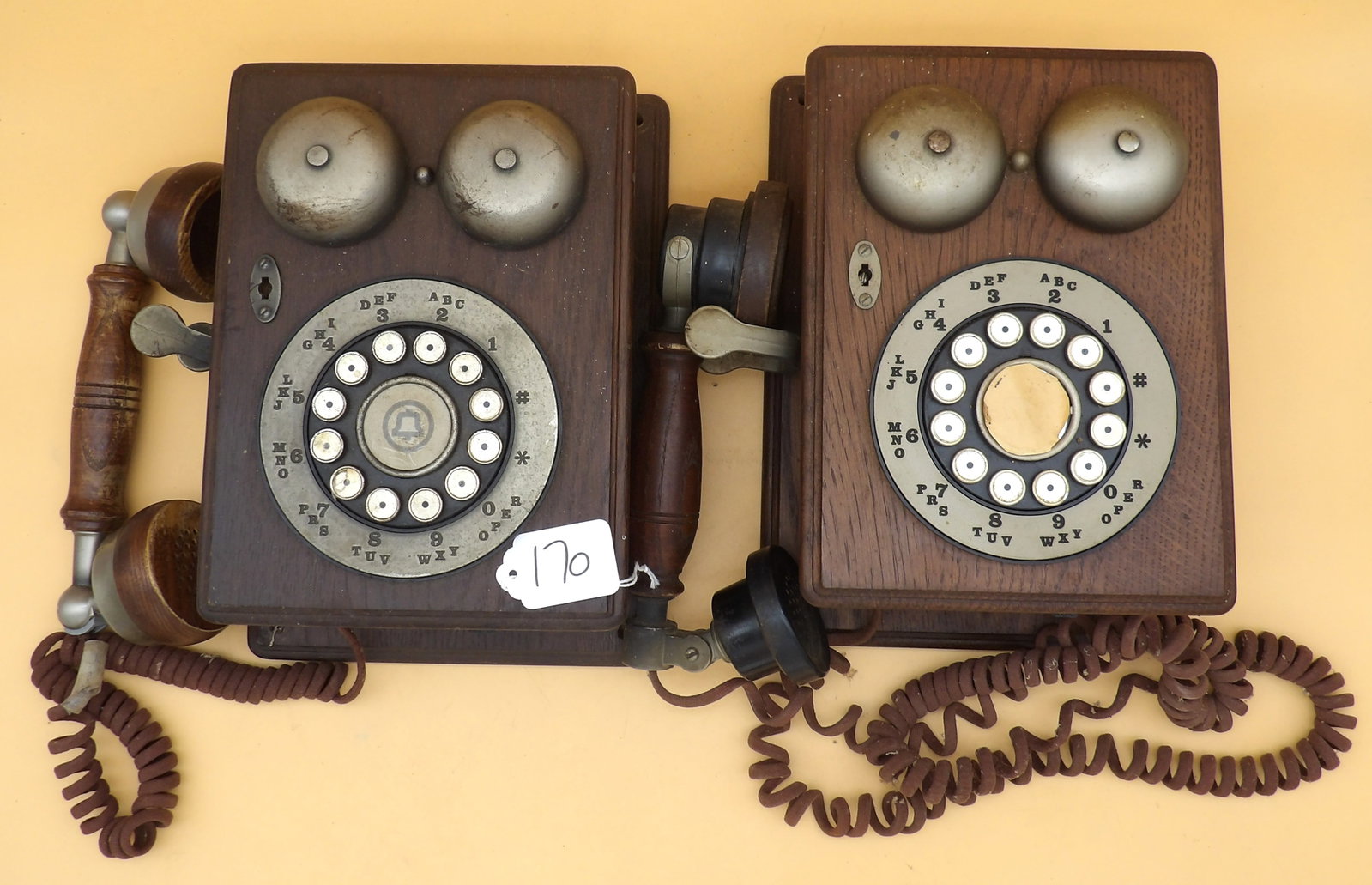 Western Electric Country Junction Bell Wall Telephones (2): This pair of vintage 1970's / 1980's Western Electric olde-style wall telephones features touch-buttons and measure approx: 5" x 11" x 7" each.