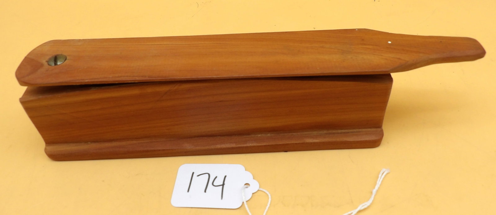 Wood Box Turkey Call By Metzger: This handmade box-style turkey call was made by renowned local carver Lawrence Metzger. Measures approx: 2.5" x 9.5" x 1.5"