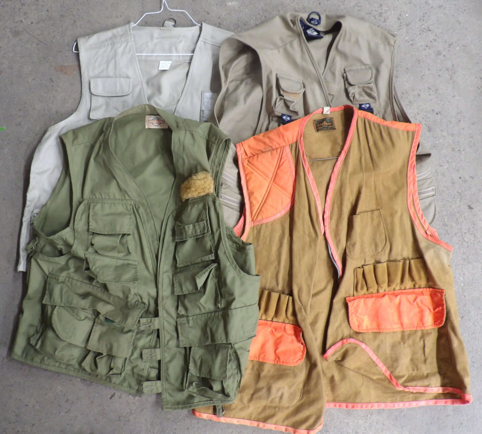 Fishing Vests (4): This lot of 4 fishing vests includes brands like "Saf-T-Back" and "Columbia Sportswear". Size Men's XL & XXL.