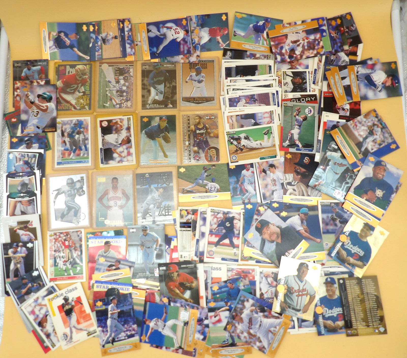 Sports Trading Cards - Football, Baseball, Basketball: This large lot of sports cards include Upper Deck, Fleer Ultra, Skybox, Post, and more - and range from 1993 - 1996. Includes legendary names like Ken Griffey Jr, Jerry Rice, Allen Iverson, Barry
