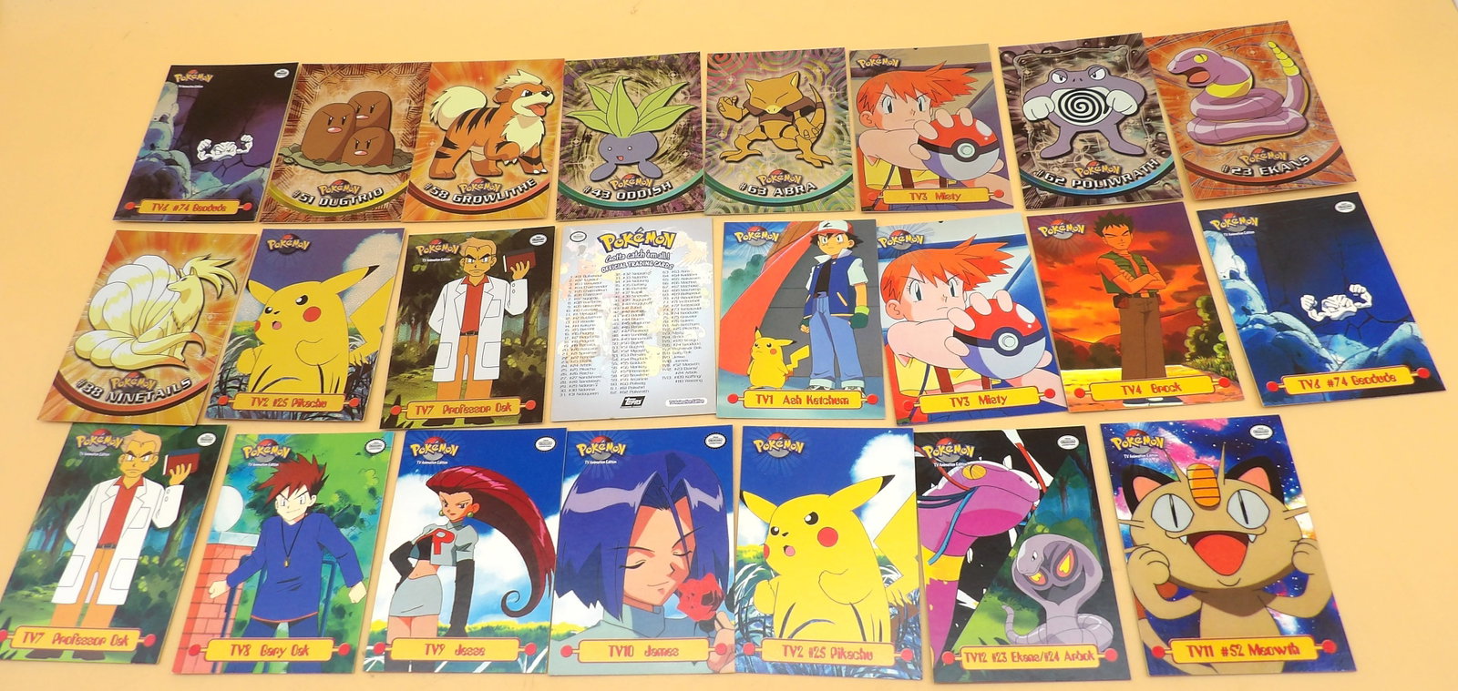 Pokemon Foil & TV Topps Trading Cards (23): This collection of 23 Topps (1999 2nd Edition Black Logo) Trading Cards includes 11 Foil cards, 11 TV cards, and 1 checklist card. Cards are not graded, but are in great condition w/ no significant