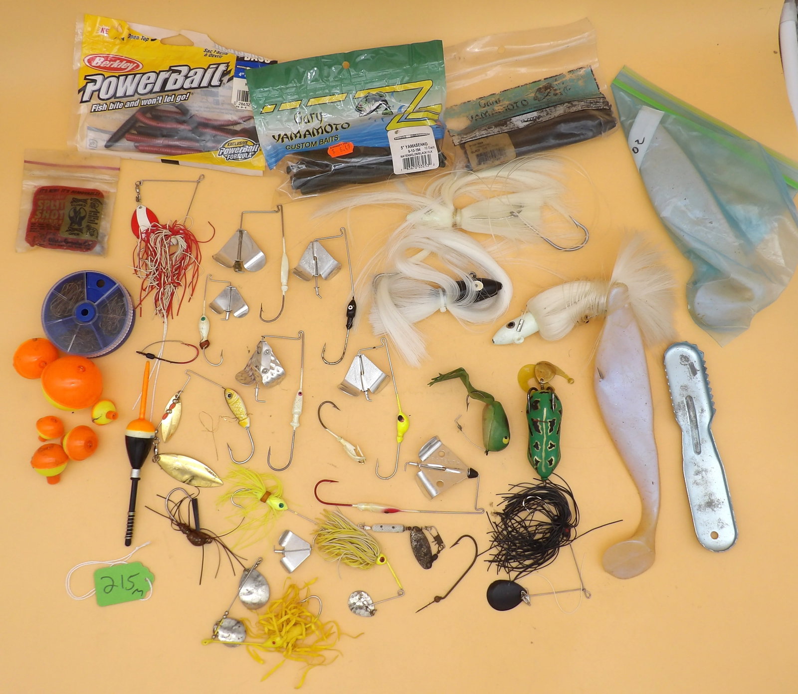Vintage Fishing Lures, Hooks, Accessories (w/ tacklebox): An assortment of lures, hooks, bobs, and weights. Brands like StrikeKing, Spro, Eagle Claw, Power Bait, Gary Yamamoto, and more. Included: Plano tackle box.