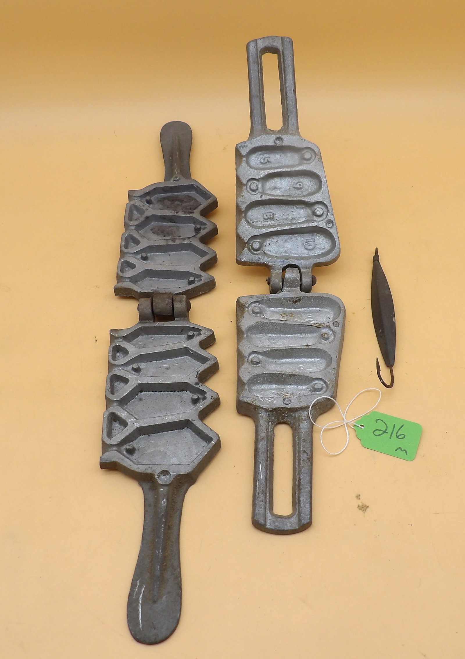 Lead Sink Weight Molds + Weighted Hook: This lot includes 2 metal molds to make lead sinker weights, along with a vintage weighted hook.