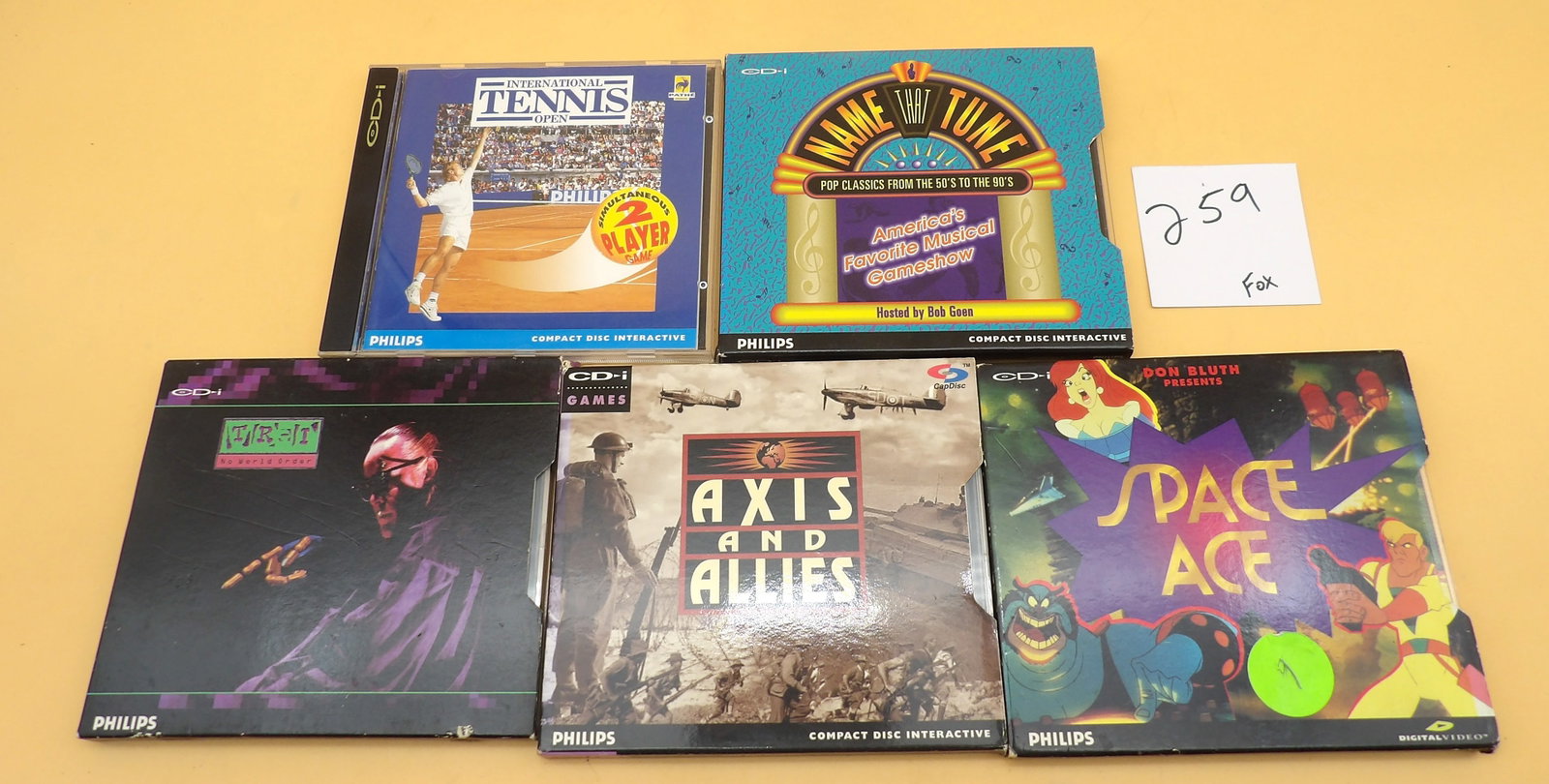 CD-i Video Games (5 pcs): This collection of 5 vintage CD-i games includes the TR-I: No World Order (w/ Todd Rundgren), Axis & Allies, Space Ace, International Tennis Open, and Name That Tune. All games are in great working co