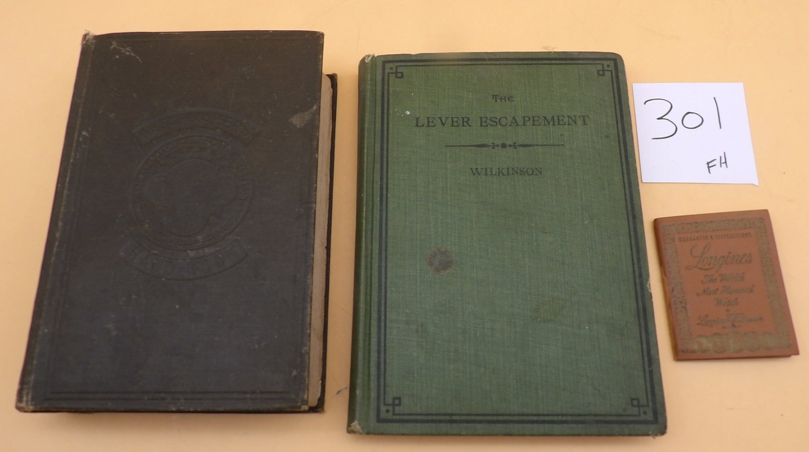 Watchmaker's Handbook, Lever Escapement, Longines Books (3): This vintage watch-book collection includes a 1920 copy of Saunier's "Watchmaker's Handbook' (includes fold out diagrams), a 1916 copy of Wilkinson's "The Lever Escapement", and a Longines watch